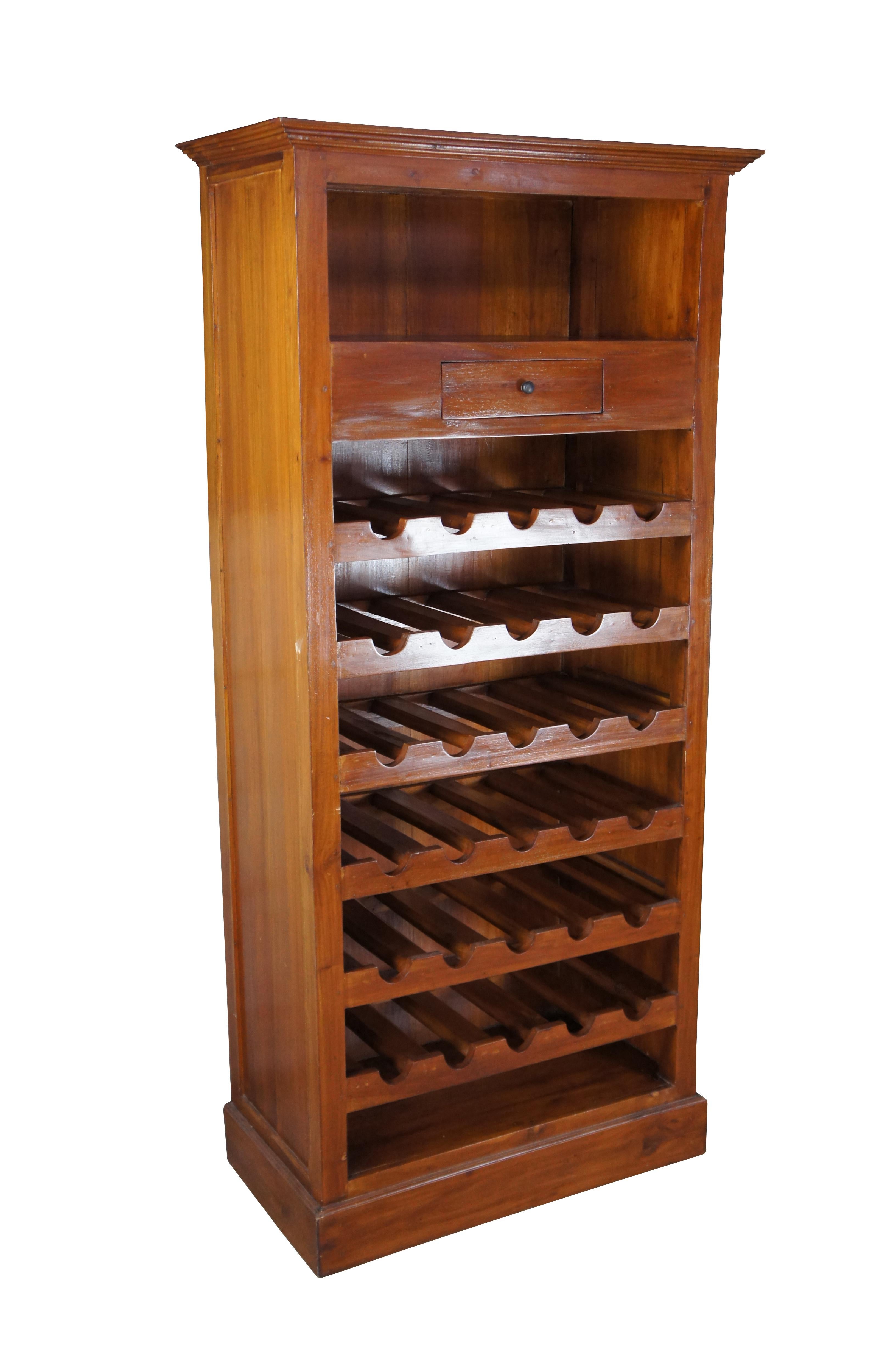Tall case wine rack / bottle holder, circa 1990s. Made from mahogany with central gallery for wine display, an upper drawer and two shelves.

Dimensions:
17.5