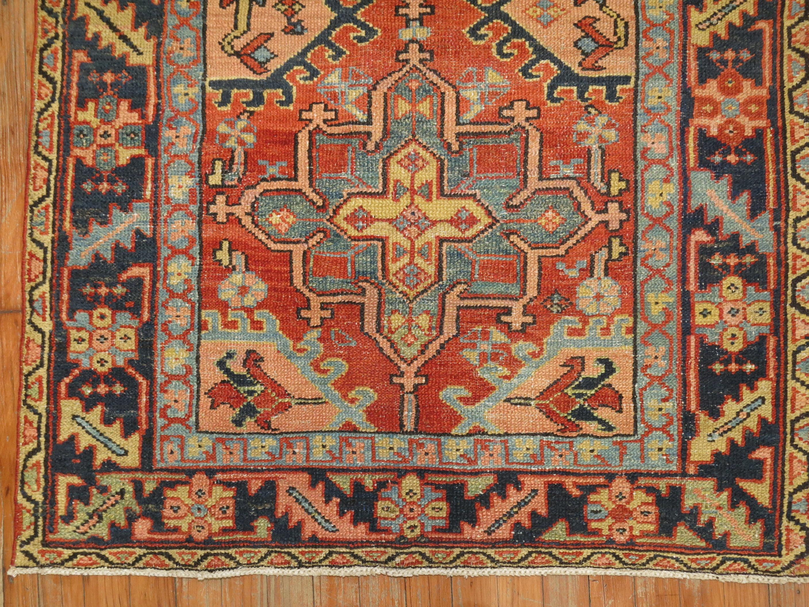 Traditional Persian Heriz Tribal scatter rug in rustic tones from the early 20th century

Measures: 3'5” x 4'5”.