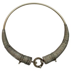 Lot - Vintage old silver chunky Middle Eastern tribal torc collar necklace  with dangling links with Rupee coins and glass jewel cabochons in red, blue  and green with stamped motif. 7 1/4