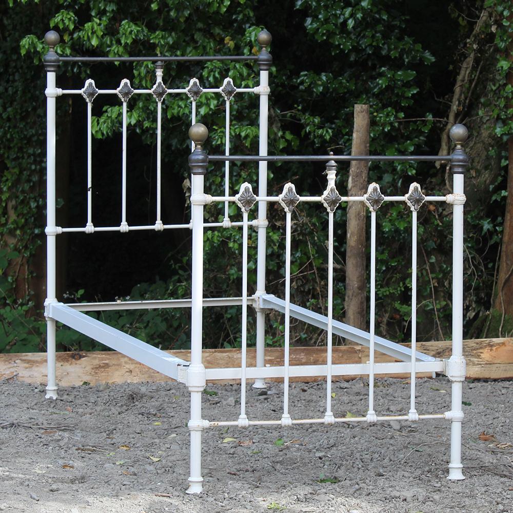 A traditional single Victorian brass and iron antique bed with brass rosettes. The bed is displayed here in original condition with faded brass. We can restore the bed in any colour you wish and polish the brass if required.

This bed takes a