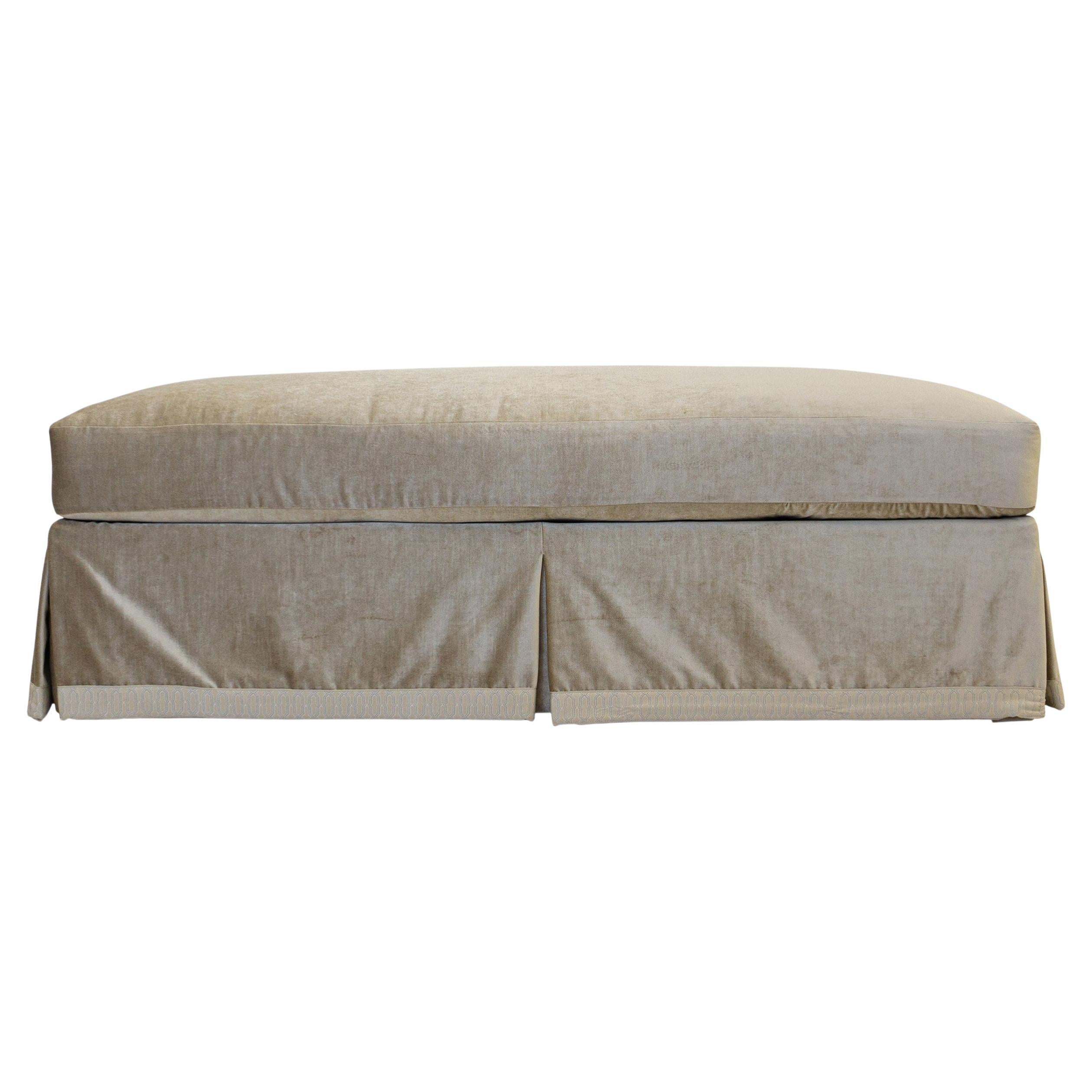 This piece is currently only available as a custom made piece. The price shown DOES NOT include fabric.

Elegant skirted ottoman with loose cushion and tape detail. Fully customizable and requires 8 yards fabric plus trim if used. Ask us about