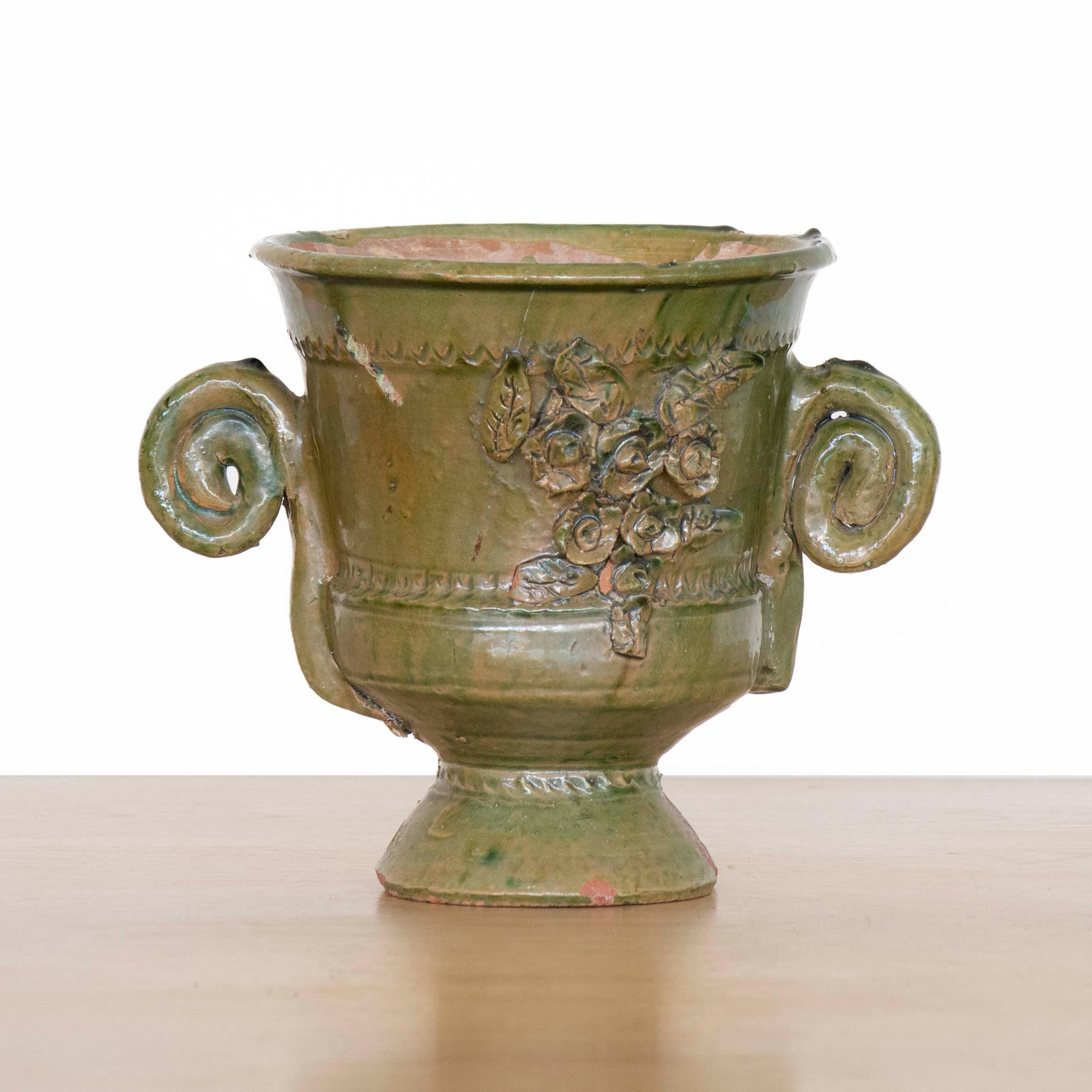 Beautiful vintage traditional ceramic pot from Spain. Stunning sage green glaze with spiral handles and floral applique detail. Small chips and cracks consistent with age, structurally sound. 