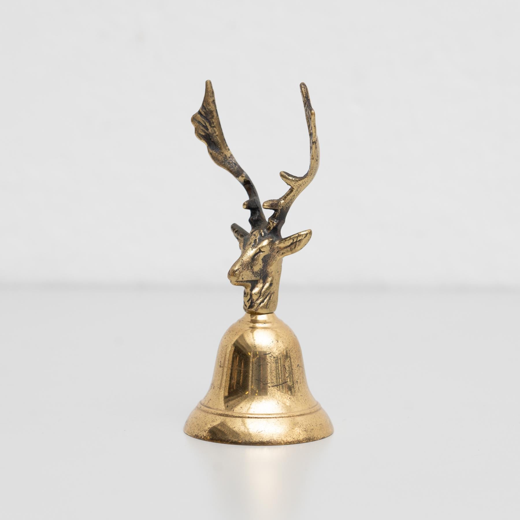 Traditional rustic metal hand bell shaped as a deer, by unknown manufacturer from Spain, circa 1950.

In original condition, with minor wear consistent with age and use, preserving a beautiful patina.

Materials:
Metal.
  