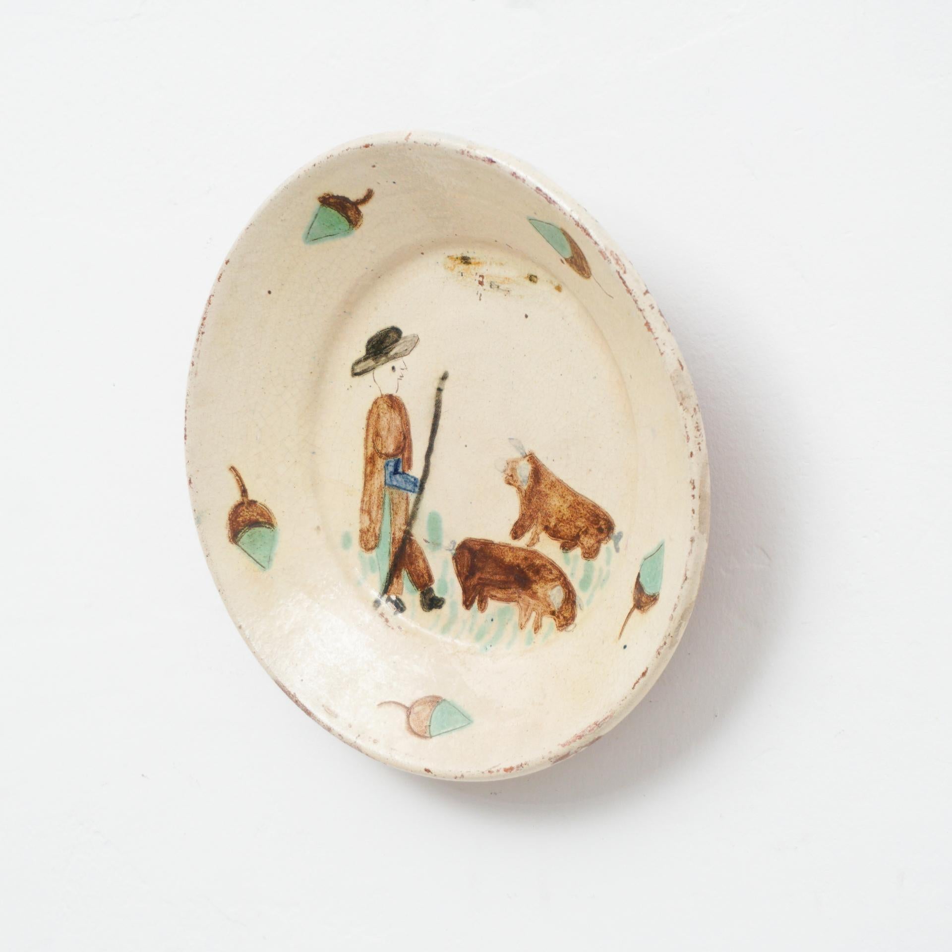 Traditional Spanish rustic decorative hand painted ceramic plate, circa 1920    

In original condition, with minor wear consistent with age and use, preserving a beautiful patina.    