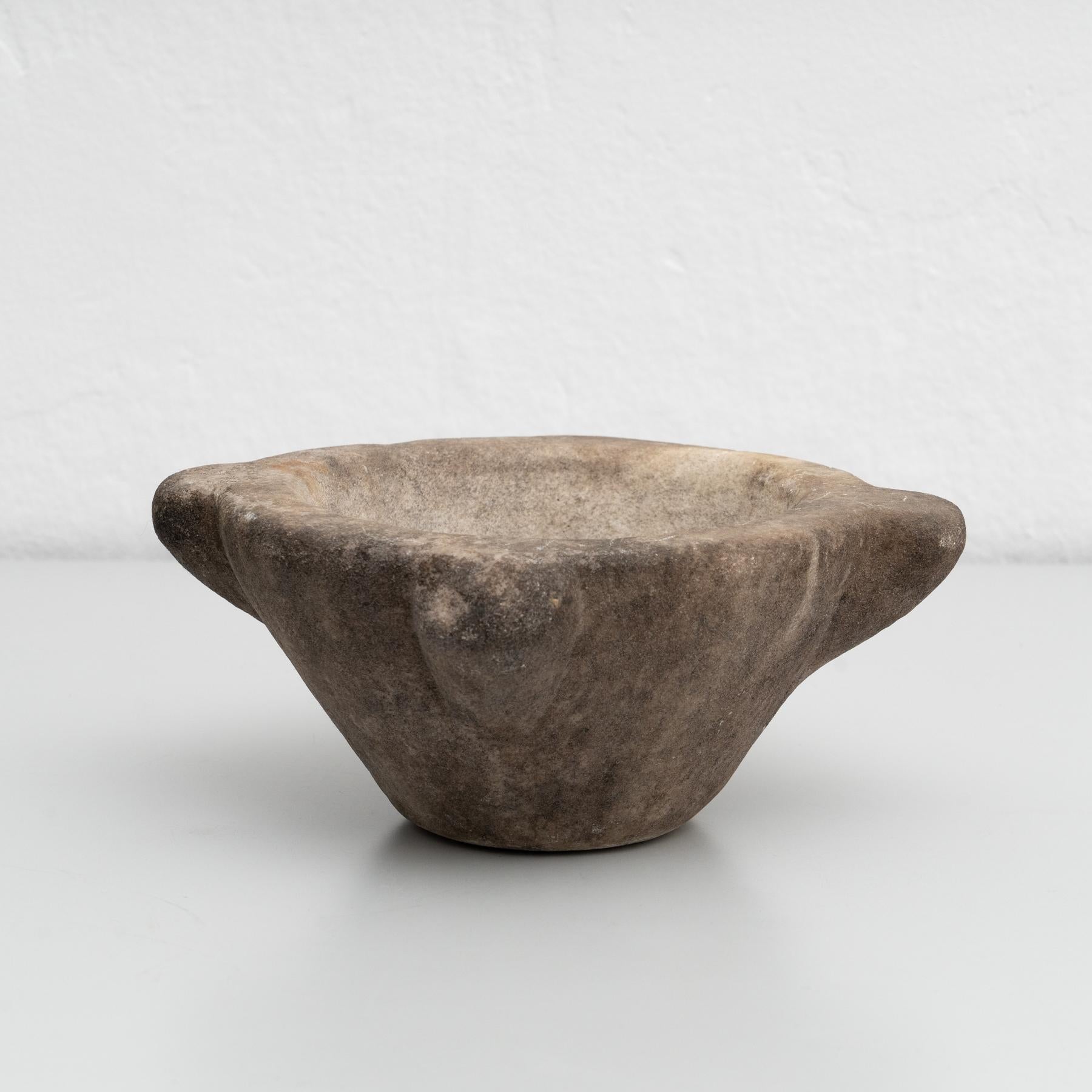 Antique vintage stone mortar. 

Made by unknown manufacturer in Spain circa 1930.

In original condition, with minor wear consistent with age and use, preserving a beautiful patina.

Materials:
Stone.
  