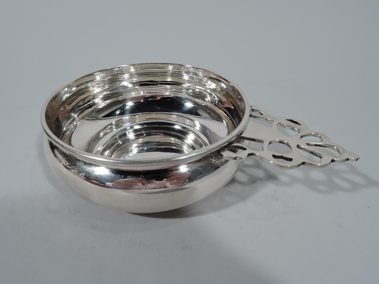 Traditional sterling silver porringer. Made by Gorham in Providence. Bellied bowl and open tree handle. Hallmark includes no. 242. Weight: 5.8 troy ounces.