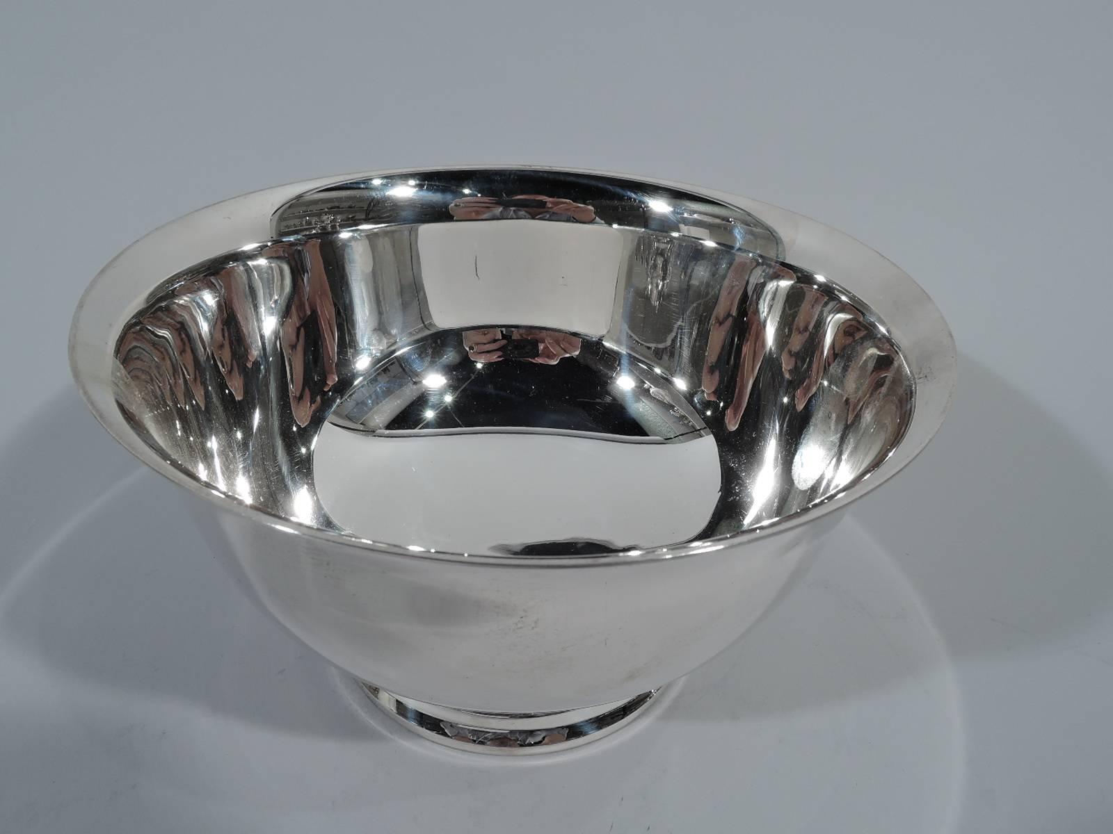 Traditional sterling silver revere bowl. Made by Gorham in Providence in 1948. Curved with flared rim and stepped foot. A historic form that can suit many modern uses. Hallmark includes date code, no. 41659, and phrase “P. Revere Reproduction”.