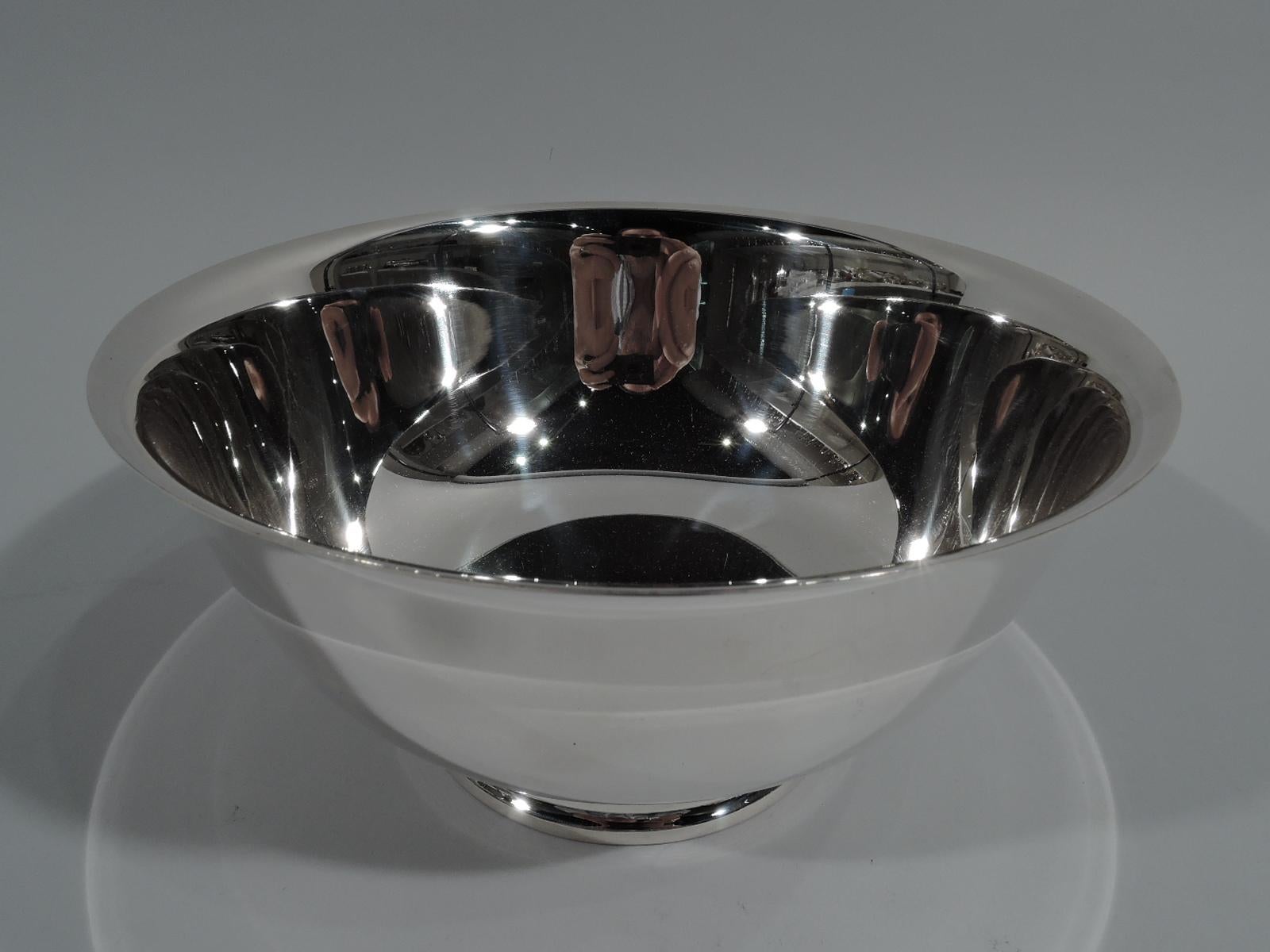 Traditional sterling silver Revere bowl. Made by International in Meriden, Conn. Classic form with tapering sides with curved bottom, flared rim, and stepped foot. Fully marked including phrase “Paul Revere / reproduction” and no. D261. Heavy