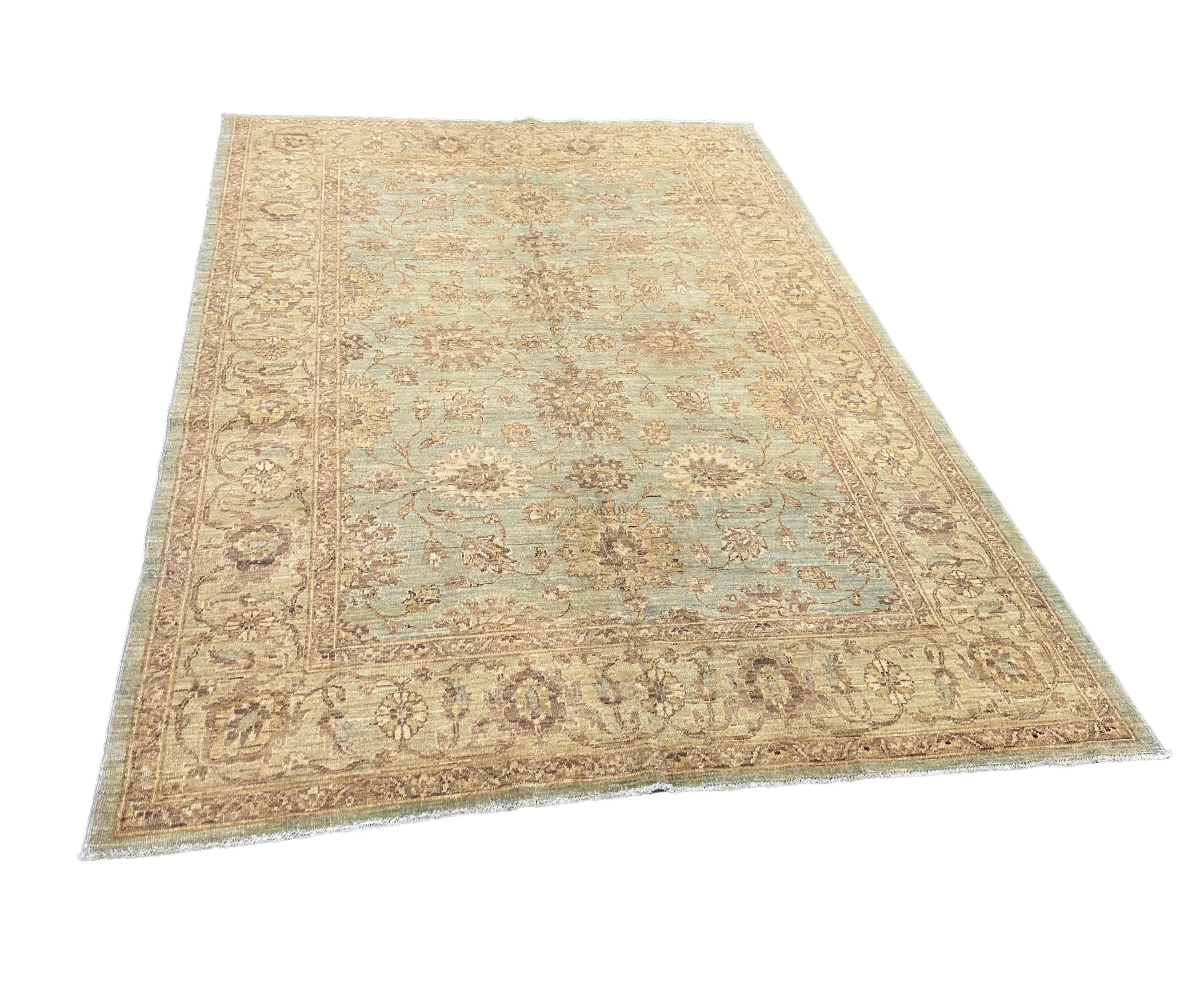 Introduce timeless elegance to your home with this traditional Pakistani rug, featuring a beautiful floral pattern in rich blue and golden tones. Expertly hand-knotted by master weavers, this rug captures the essence of Pakistani craftsmanship and