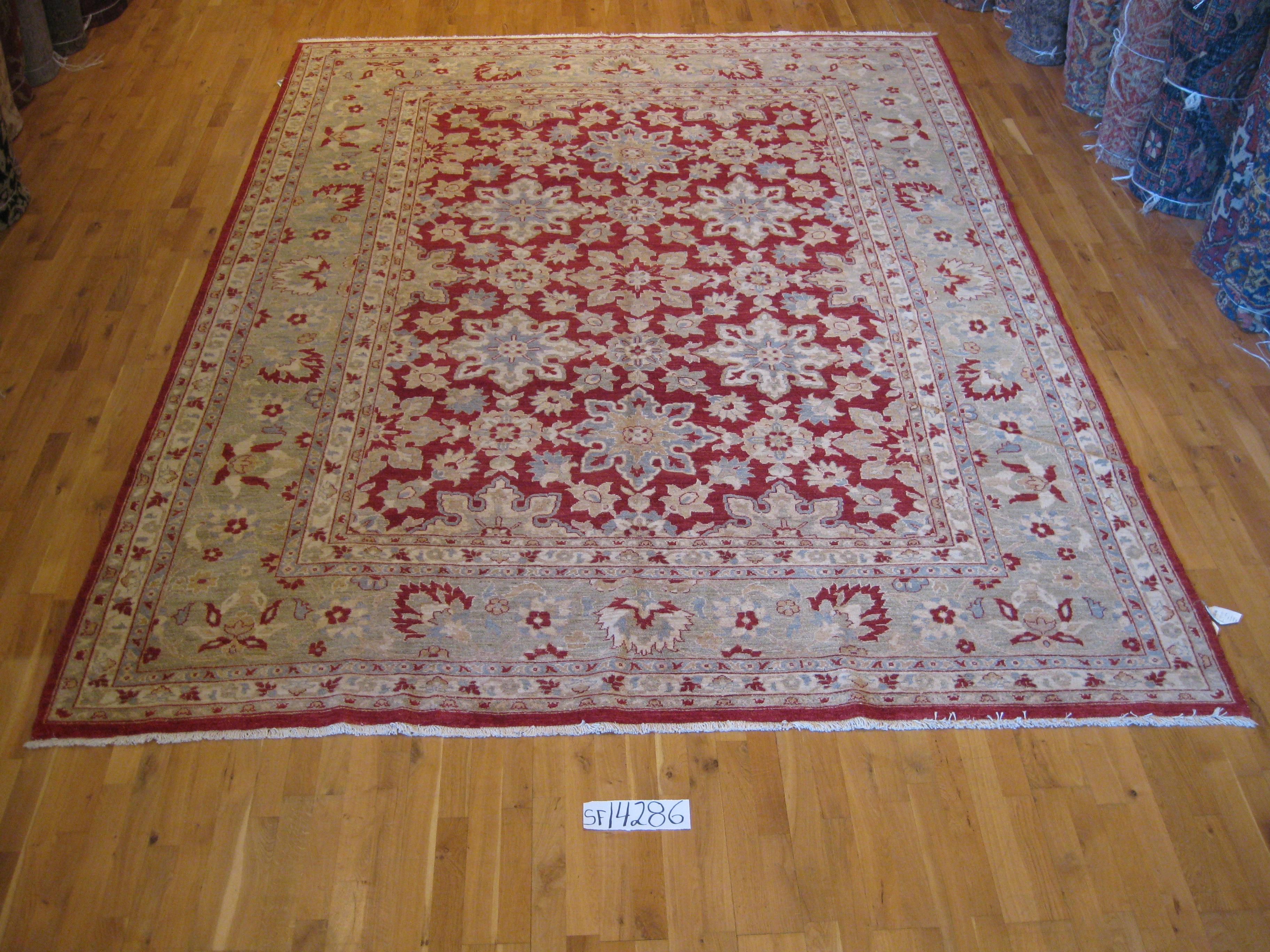 Fine Pakistani rug made with vegetal dye. A stunning piece for the dining area or living room. Durable hand knotted wool construction that is also comfortable under foot.
 