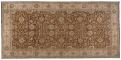 Tapis de style traditionnel dans les tons marron et beige