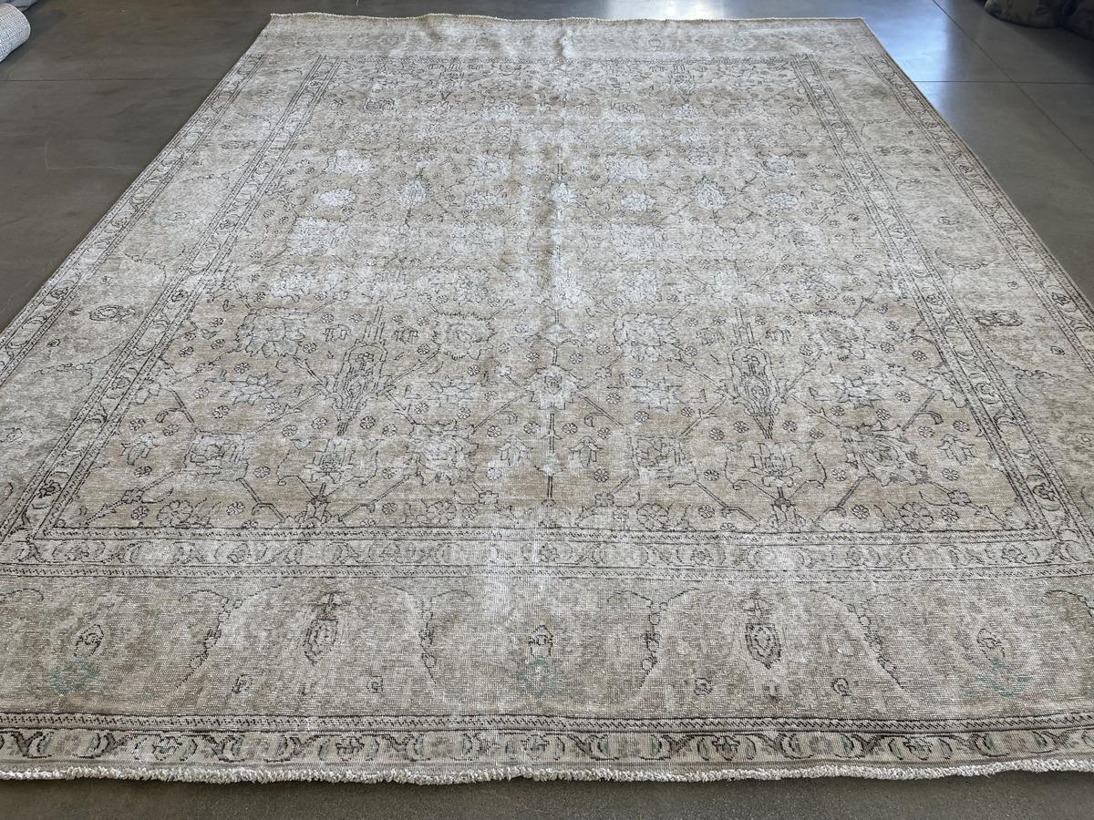 ?The traditional look receives a modern makeover in this transition rug from Pakistan featuring a large center panel with floral motif and wide outer frame. A meticulous shearing technique creates a one-of-a-kind distressed piece, removing pile but