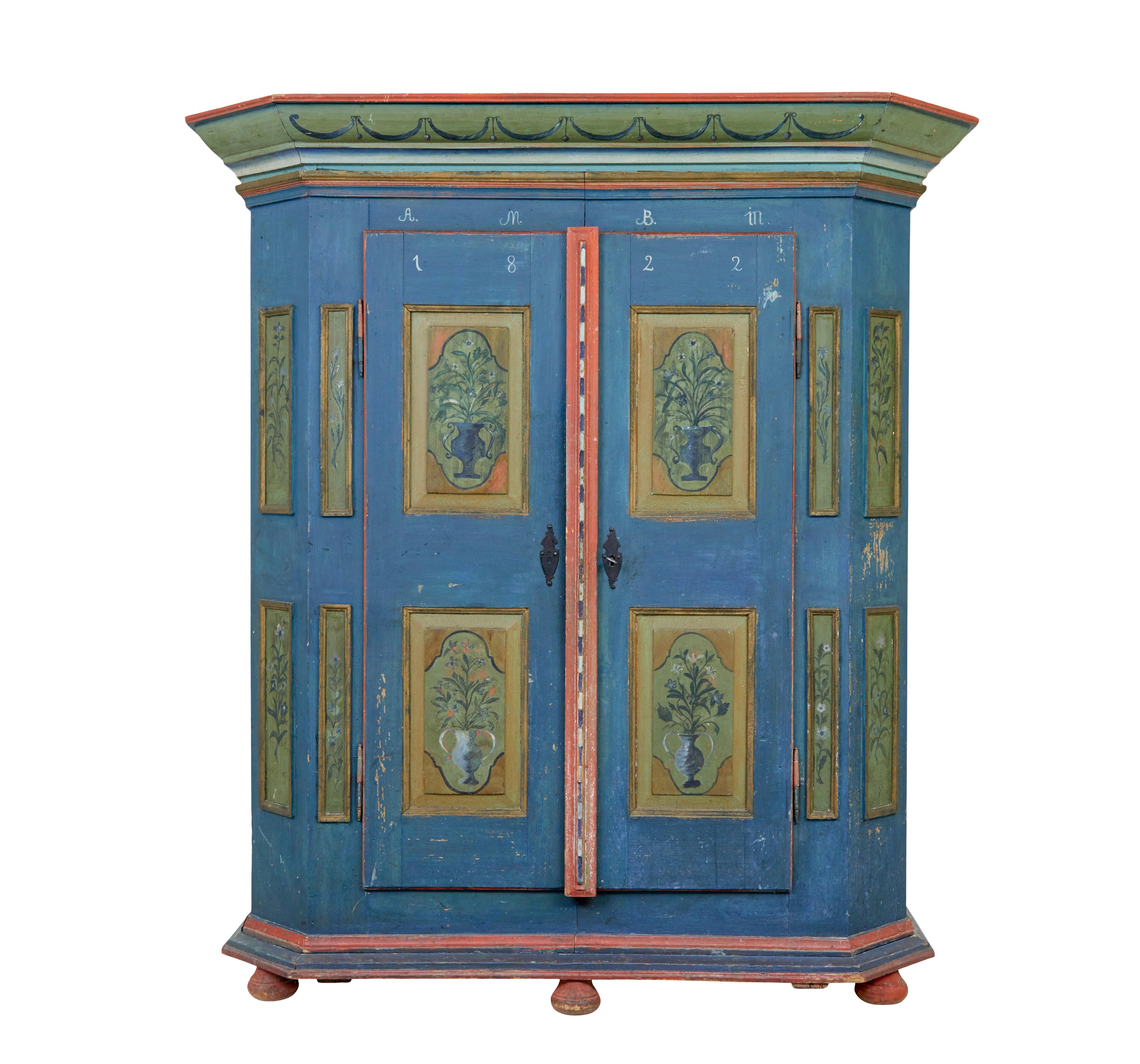 Traditional Swedish hand painted 19th century painted wardrobe circa 1822.

We are pleased to offer this piece of hand painted folk art furniture made in the early 19th century.

Comprises of 5 section's. Cornice, base, peg shelf and each half