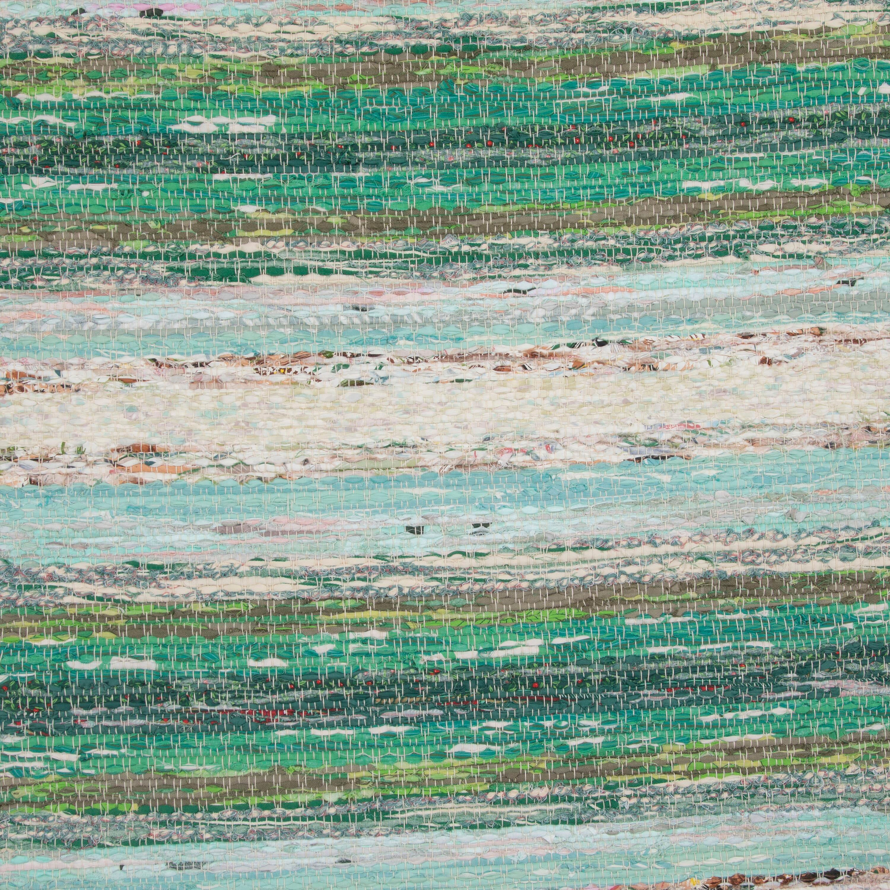 Swedish traditional rag rug in tones of green, blue, and ecru and is of a multi-striped design. 
This rug has long proportions, ideal for use within a hallway or corridor. It features a dense pattern in a range of colours that have mellowed