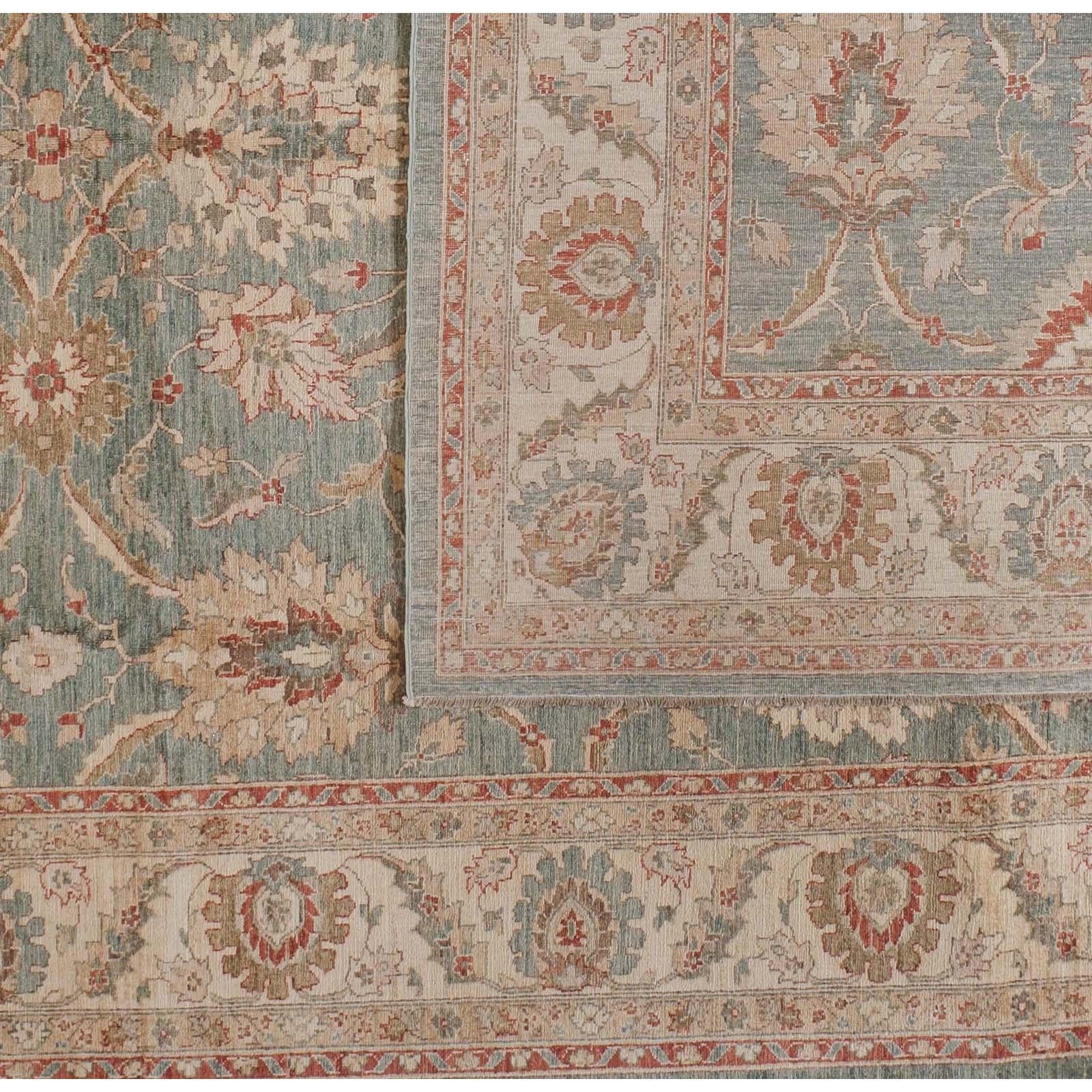 A palette of gold, teal, rust and brown comes together elegantly in this traditional Pakistani wool area rug with floral motif. Subtle gradations within each element add vibrancy and versatility for its use with a range of colors and finishes. Hand