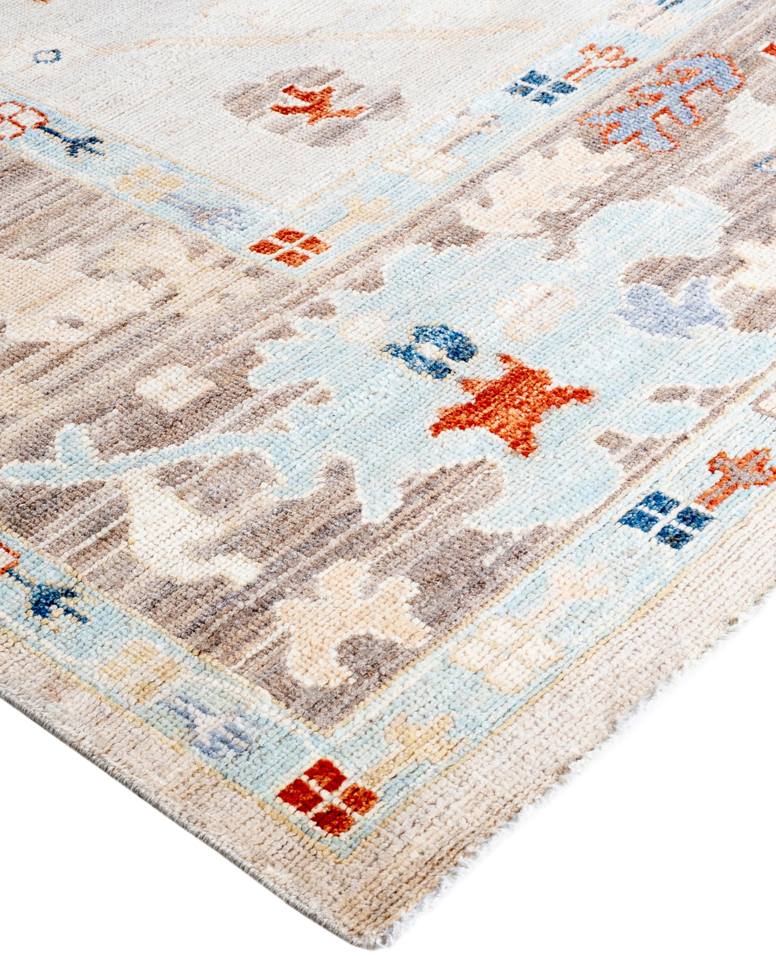 Oushak rugs are known for their soft, muted color palettes and large-scale, flowing designs. They often feature soft tones like beige, cream, gold, and light blue, with motifs that include palmettes, vines, and geometric shapes. These rugs are