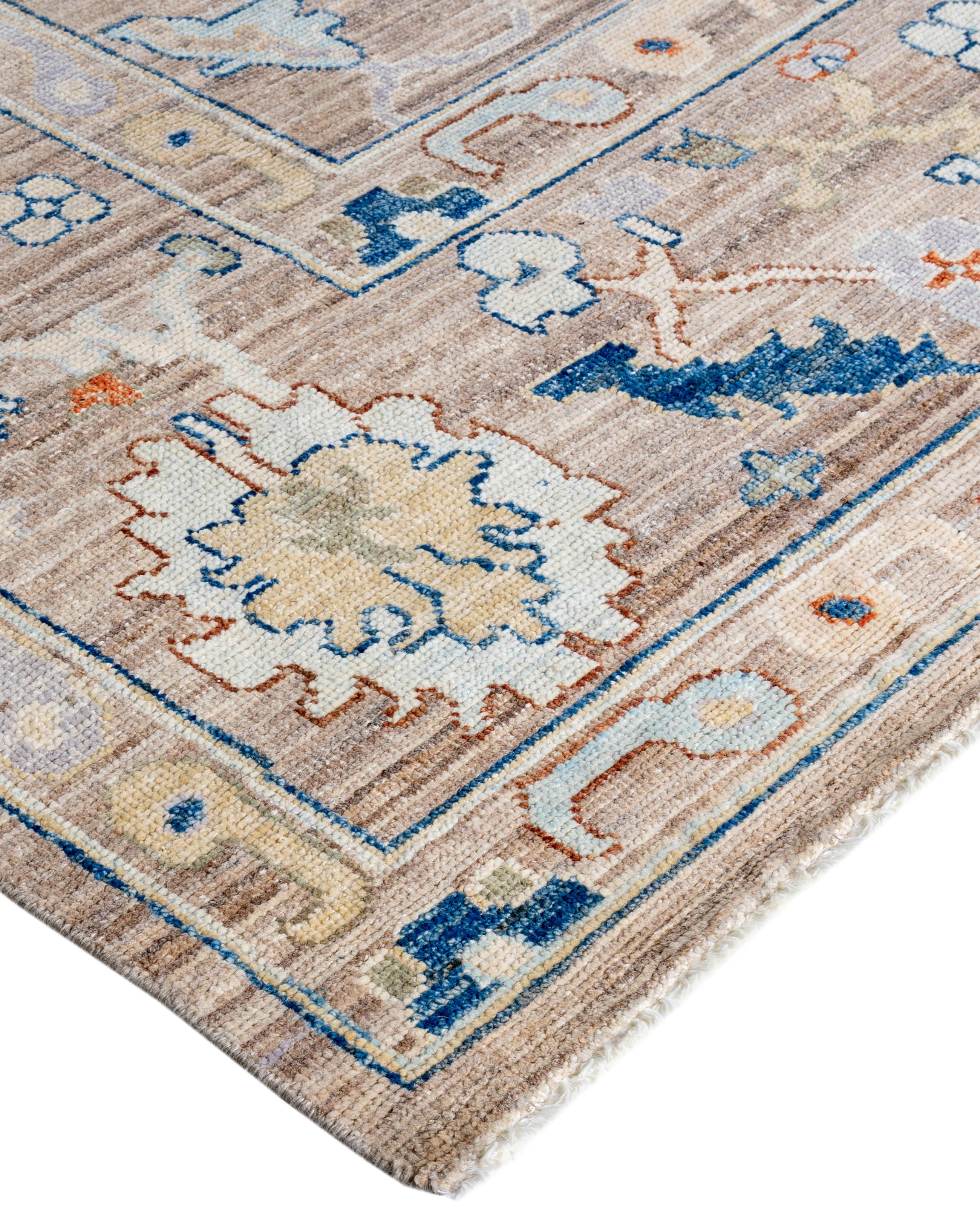 Oushak rugs are known for their soft, muted color palettes and large-scale, flowing designs. They often feature soft tones like beige, cream, gold, and light blue, with motifs that include palmettes, vines, and geometric shapes. These rugs are