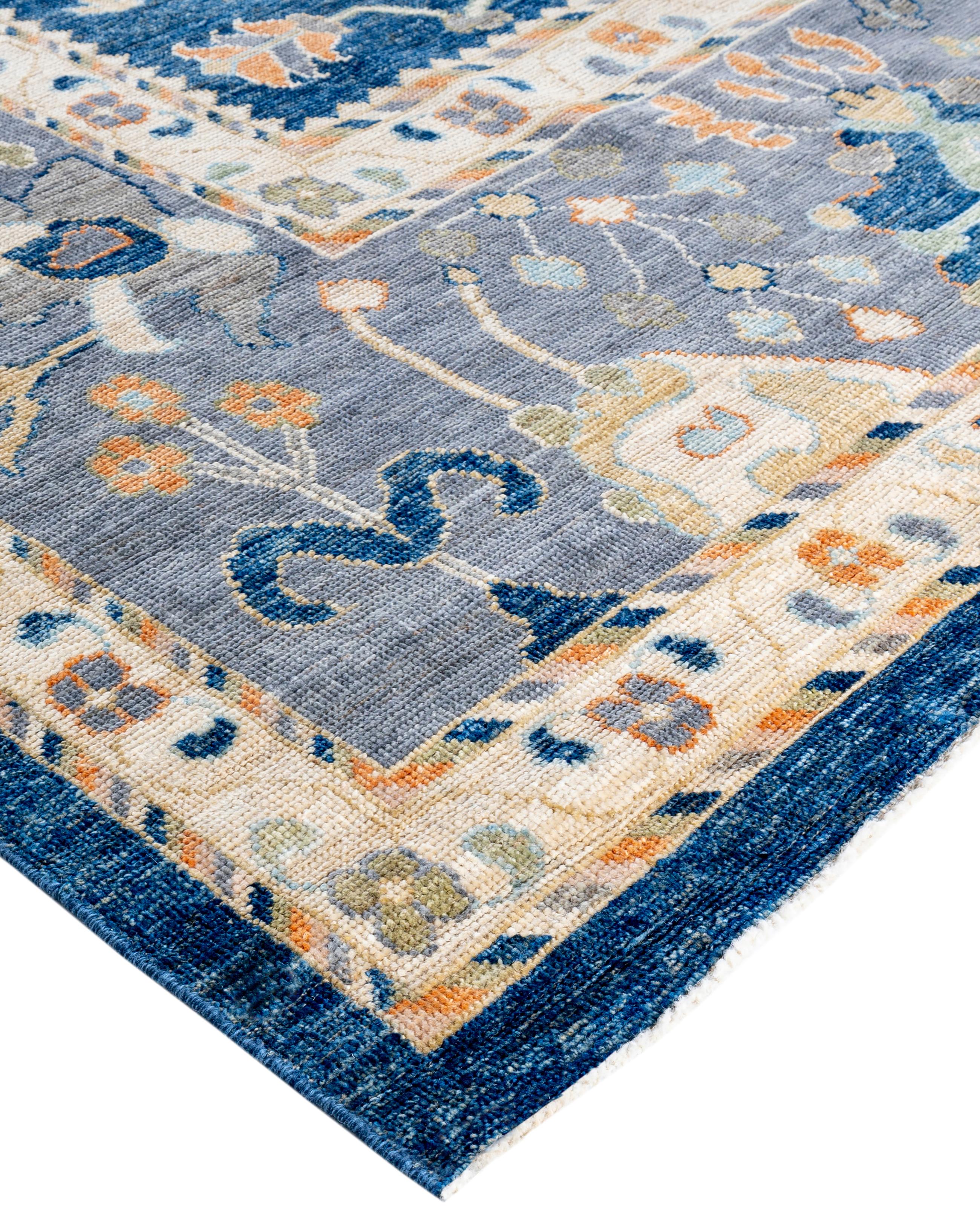Oushak rugs are known for their soft, muted color palettes and large-scale, flowing designs. They often feature soft tones like beige, cream, gold, and light blue, with motifs that include palmettes, vines, and geometric shapes. These rugs are