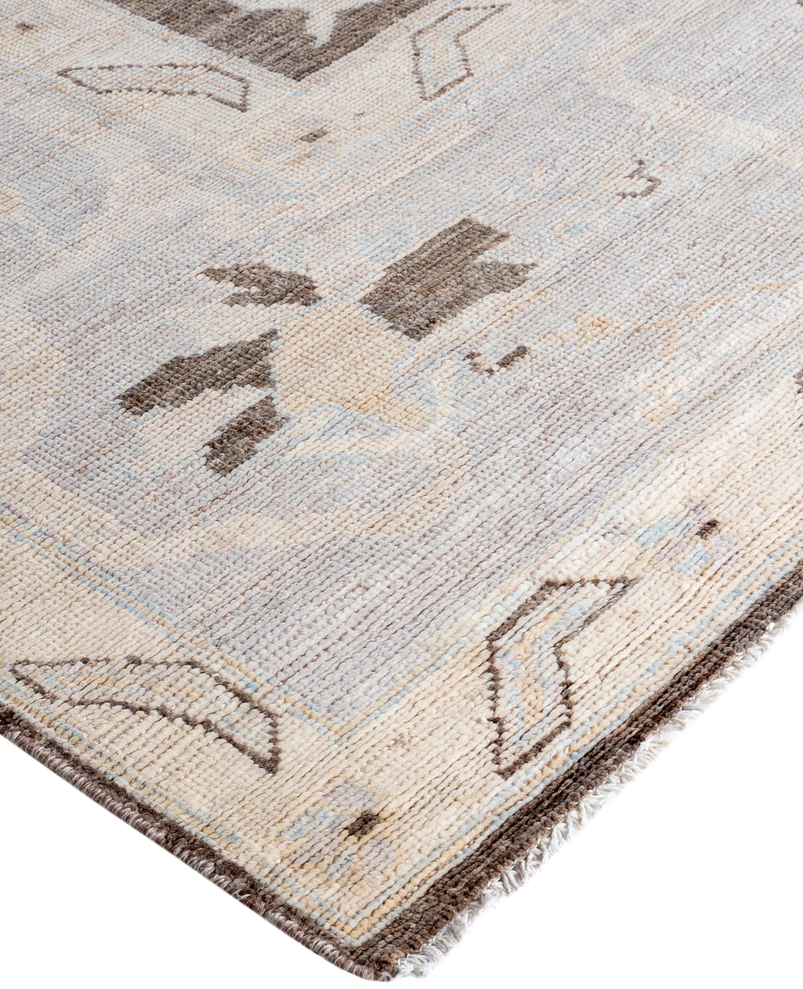 Oushak rugs are known for their soft, muted color palettes and large-scale, flowing designs. They often feature soft tones like beige, cream, gold, and light blue, with motifs that include palmettes, vines, and geometric shapes. These rugs are
