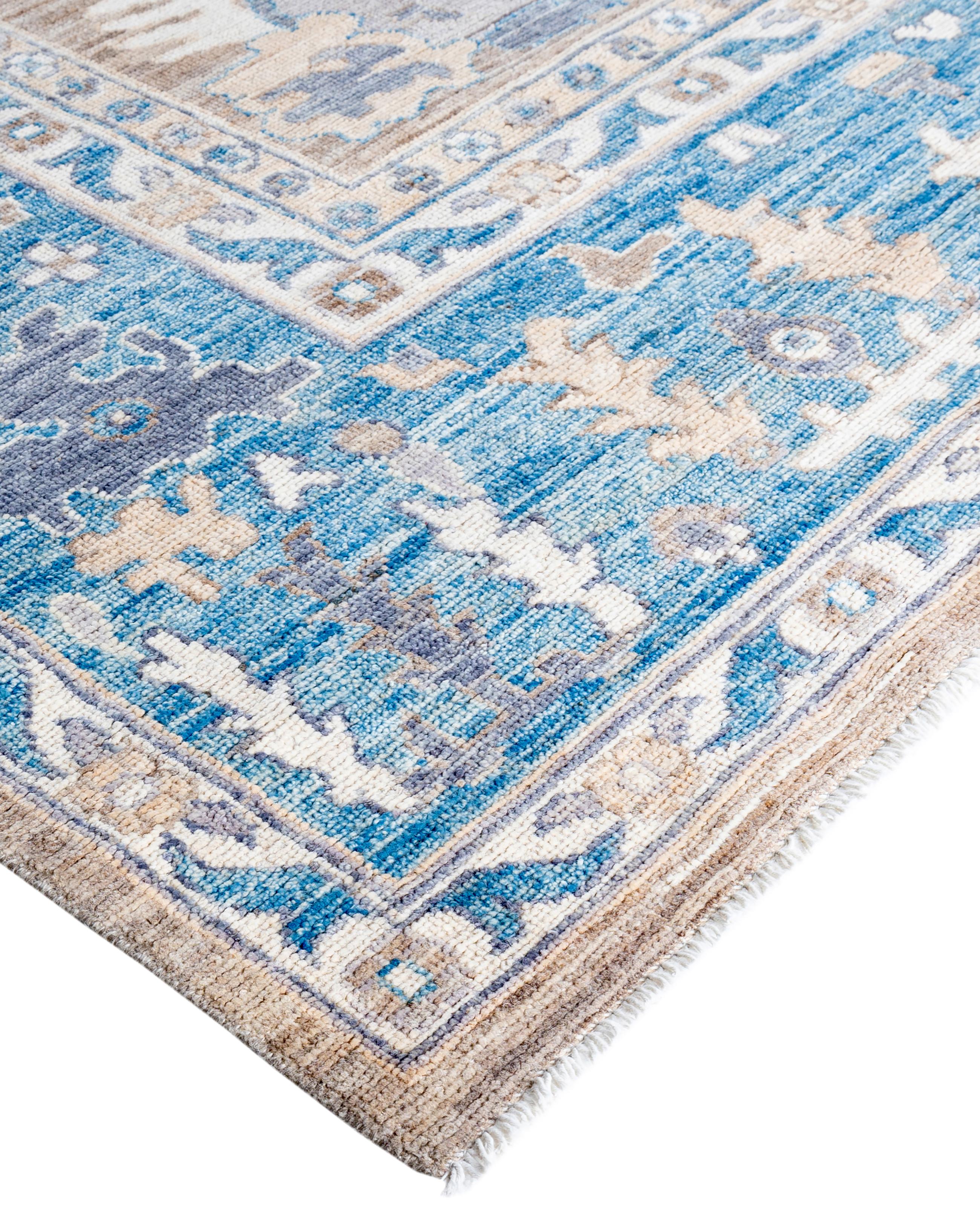 Oushak rugs are known for their soft, muted color palettes and large-scale, flowing designs. They often feature soft tones like beige, cream, gold, and light blue, with motifs that include palmettes, vines, and geometric shapes. These rugs are