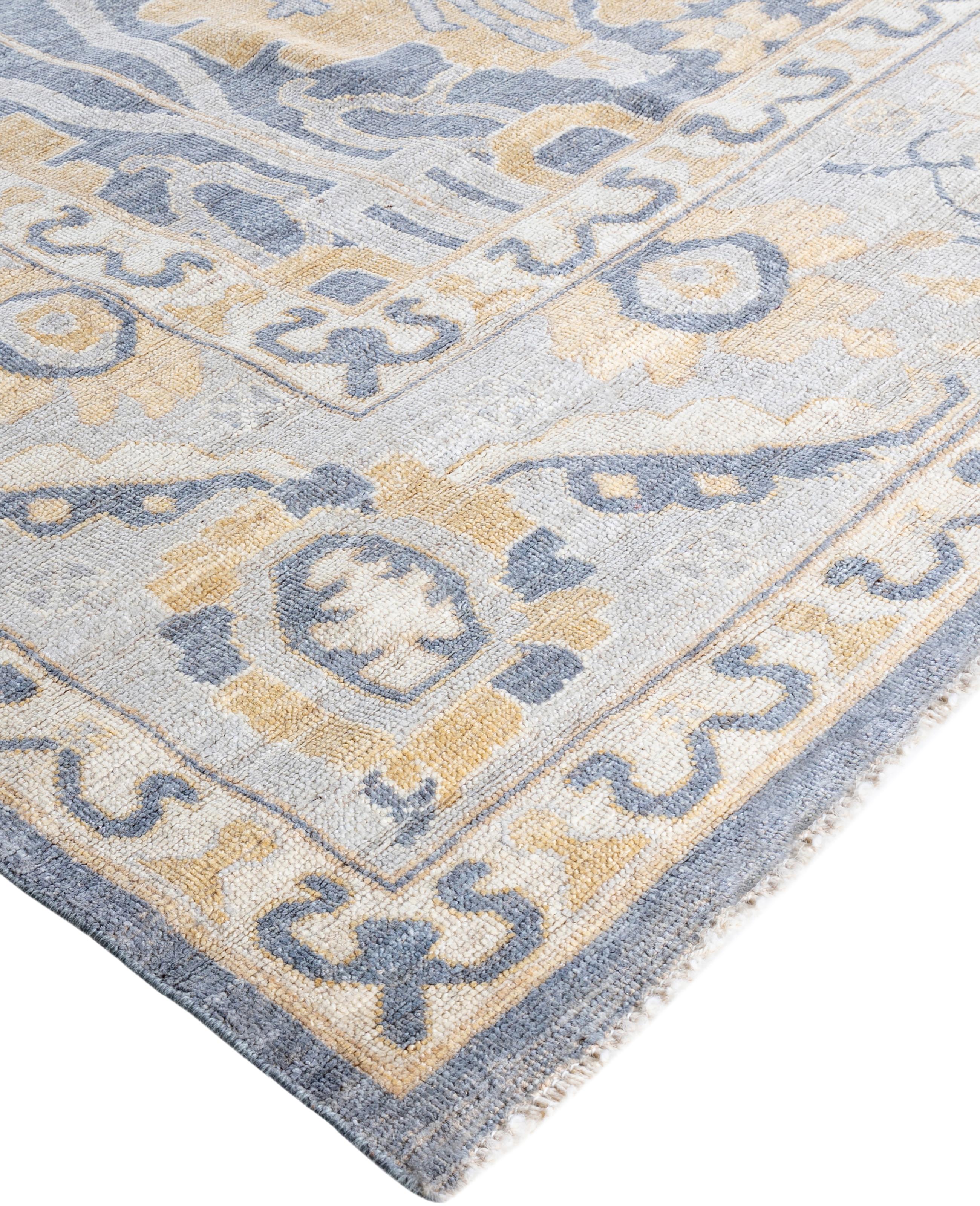 Oushak rugs are known for their soft, muted color palettes and large-scale, flowing designs. They often feature soft tones like beige, cream, gold, and light blue, with motifs that include palmettes, vines, and geometric shapes. These rugs are