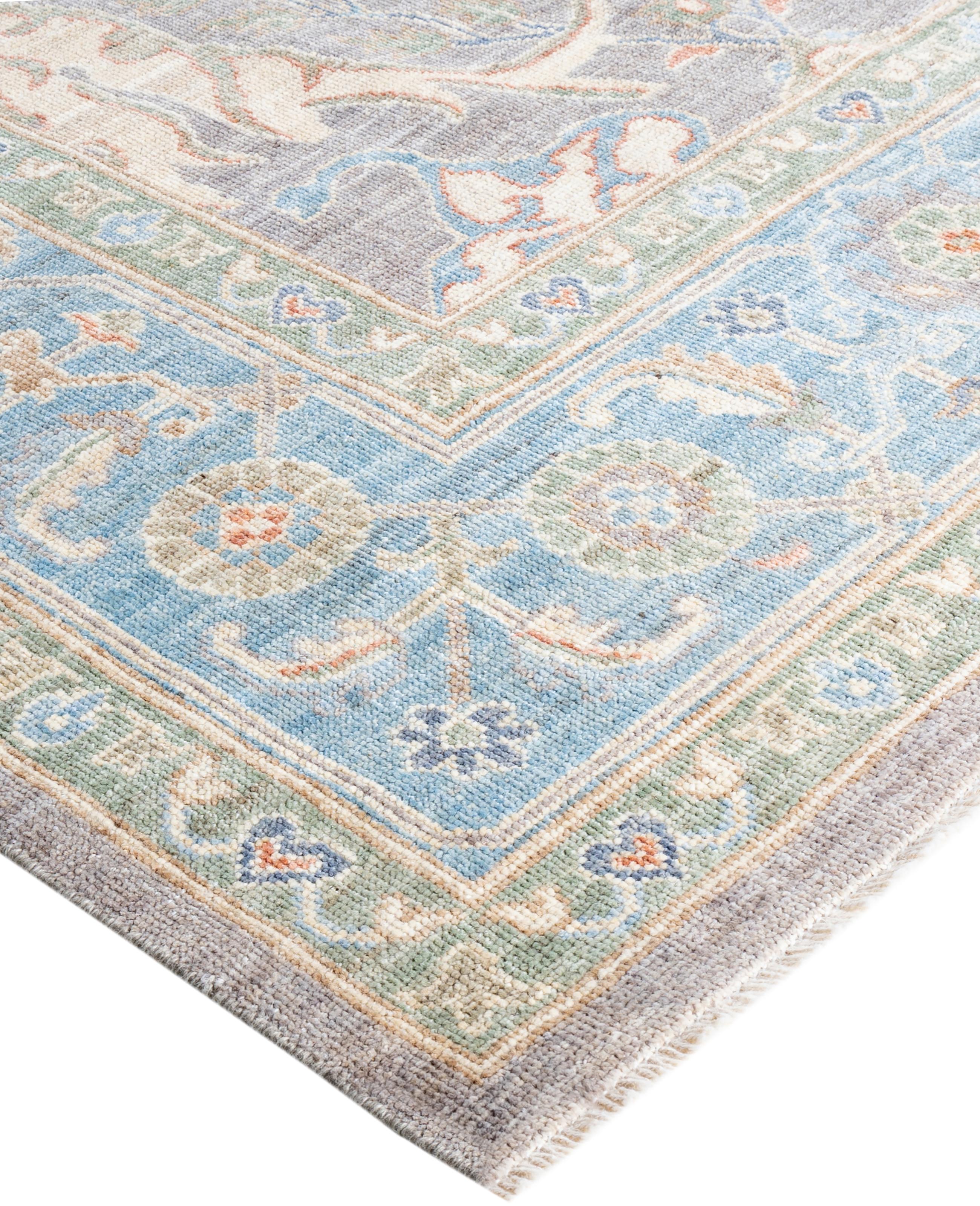 Oushak rugs are known for their soft, muted color palettes and large-scale, flowing designs. They often feature soft tones like beige, cream, gold, and light blue, with motifs that include palmettes, vines, and geometric shapes. These rugs are