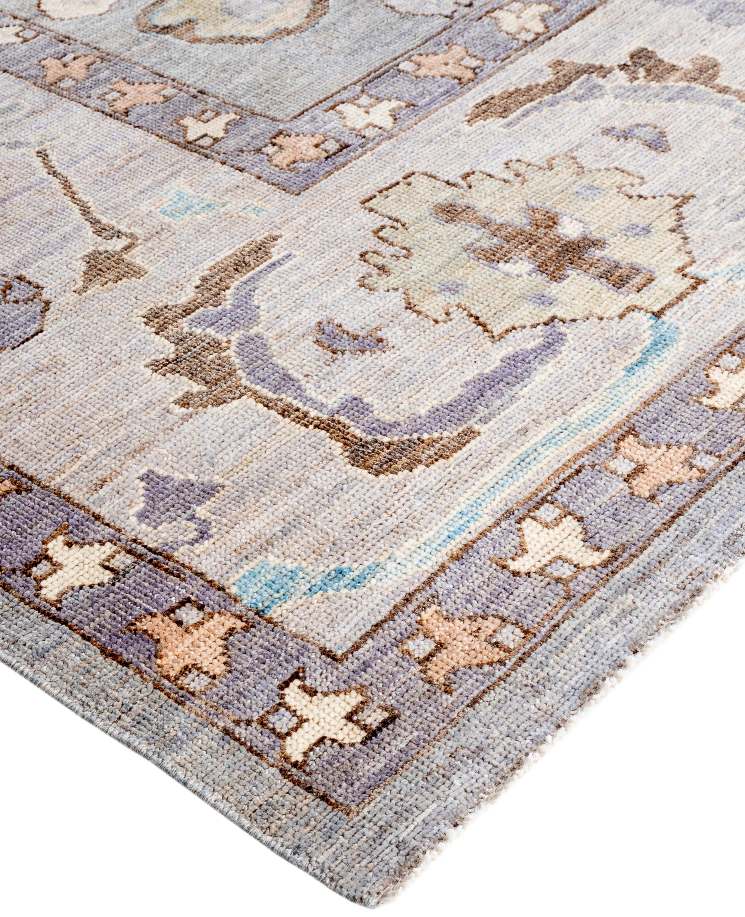 Oushak rugs are known for their soft, muted color palettes and large-scale, flowing designs. They often feature soft tones like beige, cream, gold, and light blue, with motifs that include palmettes, vines, and geometric shapes. These rugs are