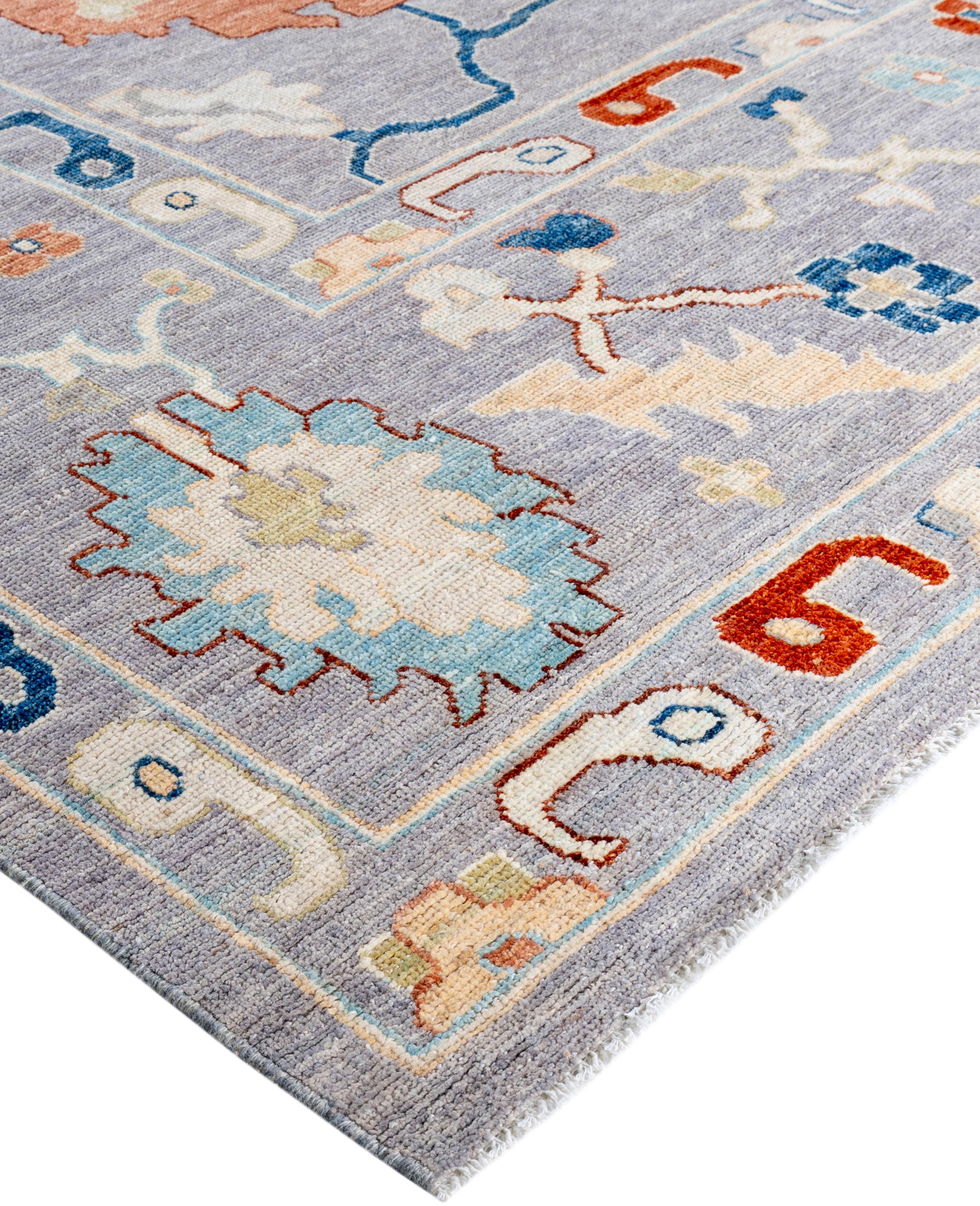 Oushak rugs are known for their soft, muted color palettes and large-scale, flowing designs. They often feature soft tones like beige, cream, gold, and light blue, with motifs that include palmettes, vines, and geometric shapes. These rugs are