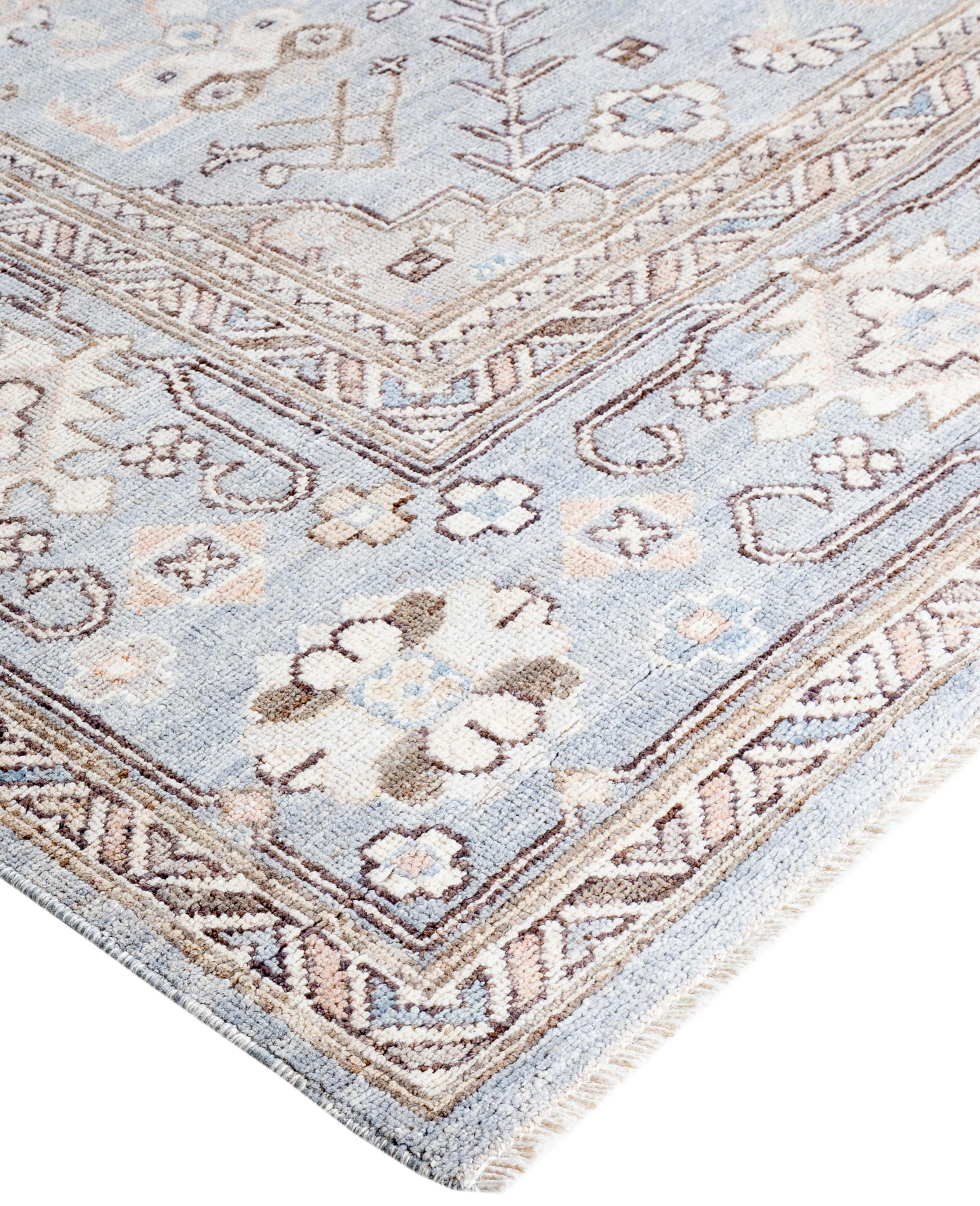 Oushak rugs are known for their soft, muted color palettes and large-scale, flowing designs. They often feature soft tones like beige, cream, gold, and light blue, with motifs that include palmettes, vines, and geometric shapes. These rugs are
