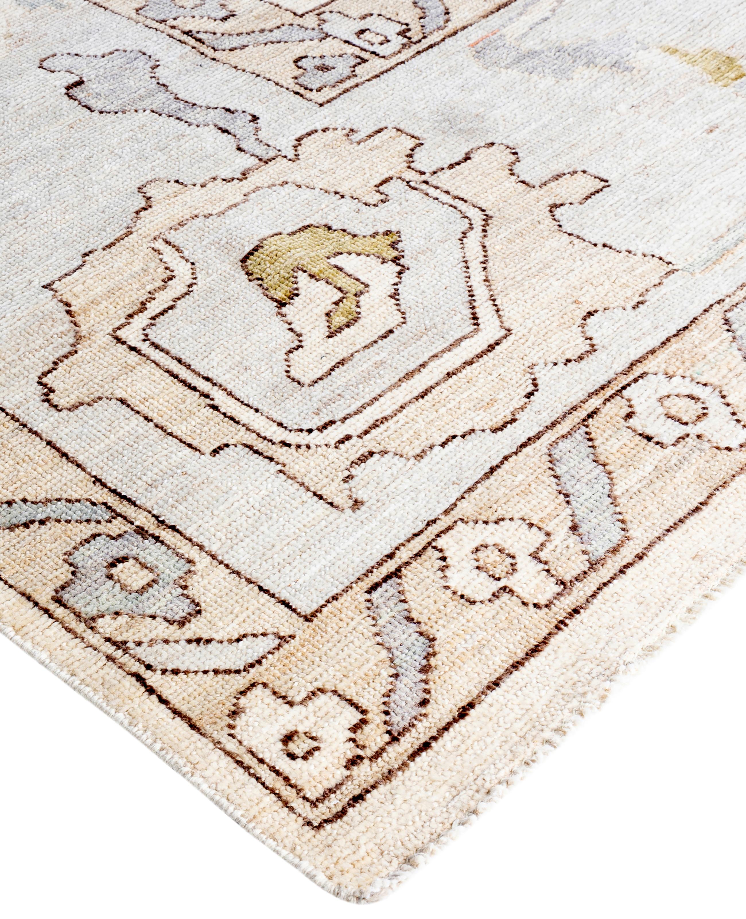 Oushak rugs are known for their soft, muted color palettes and large-scale, flowing designs. They often feature soft tones like beige, cream, gold, and light blue, with motifs that include palmettes, vines, and geometric shapes. These rugs are