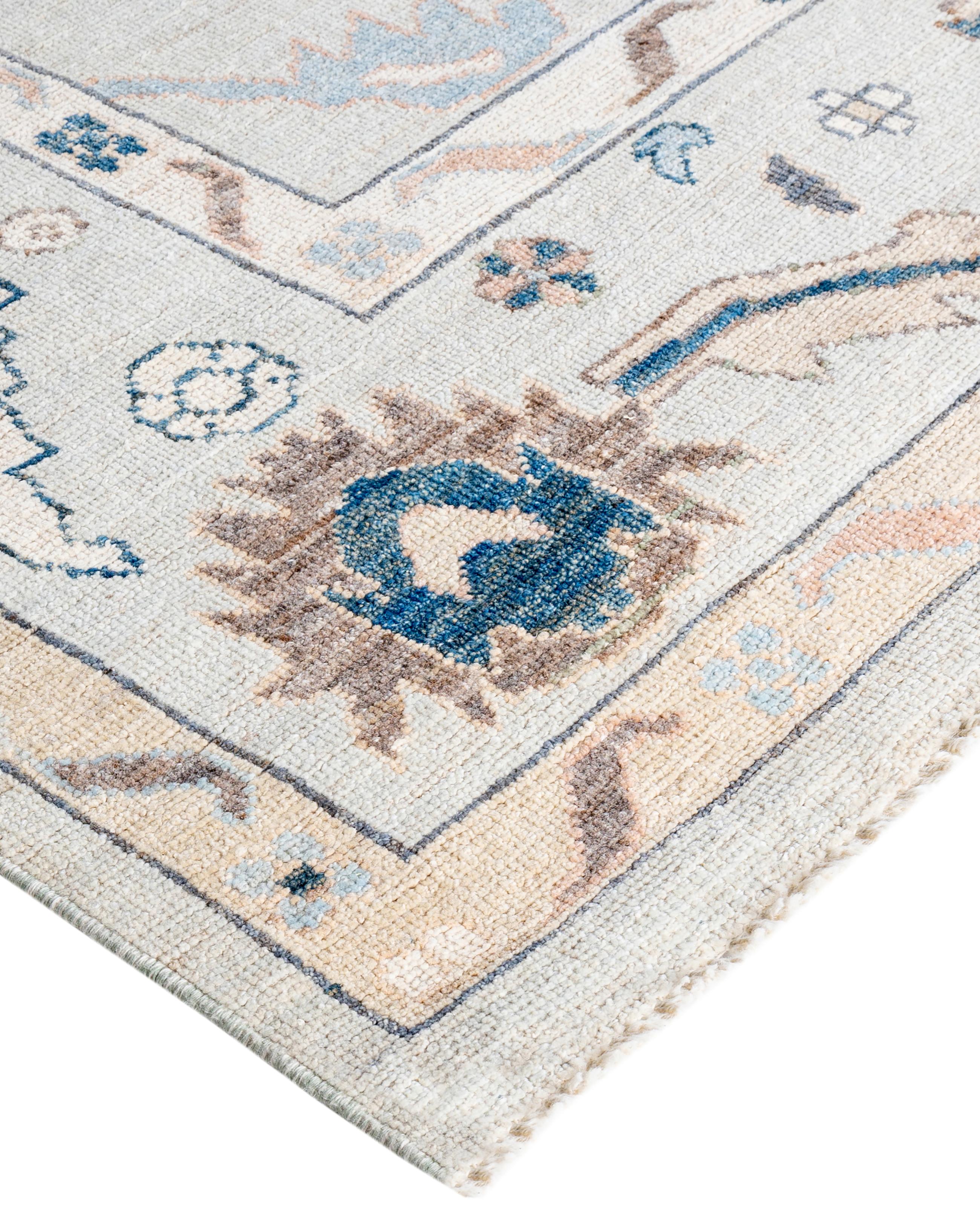 Oushak rugs are known for their soft, muted color palettes and large-scale, flowing designs. They often feature soft tones like beige, cream, gold, and light blue, with motifs that include palmettes, vines, and geometric shapes. These rugs are