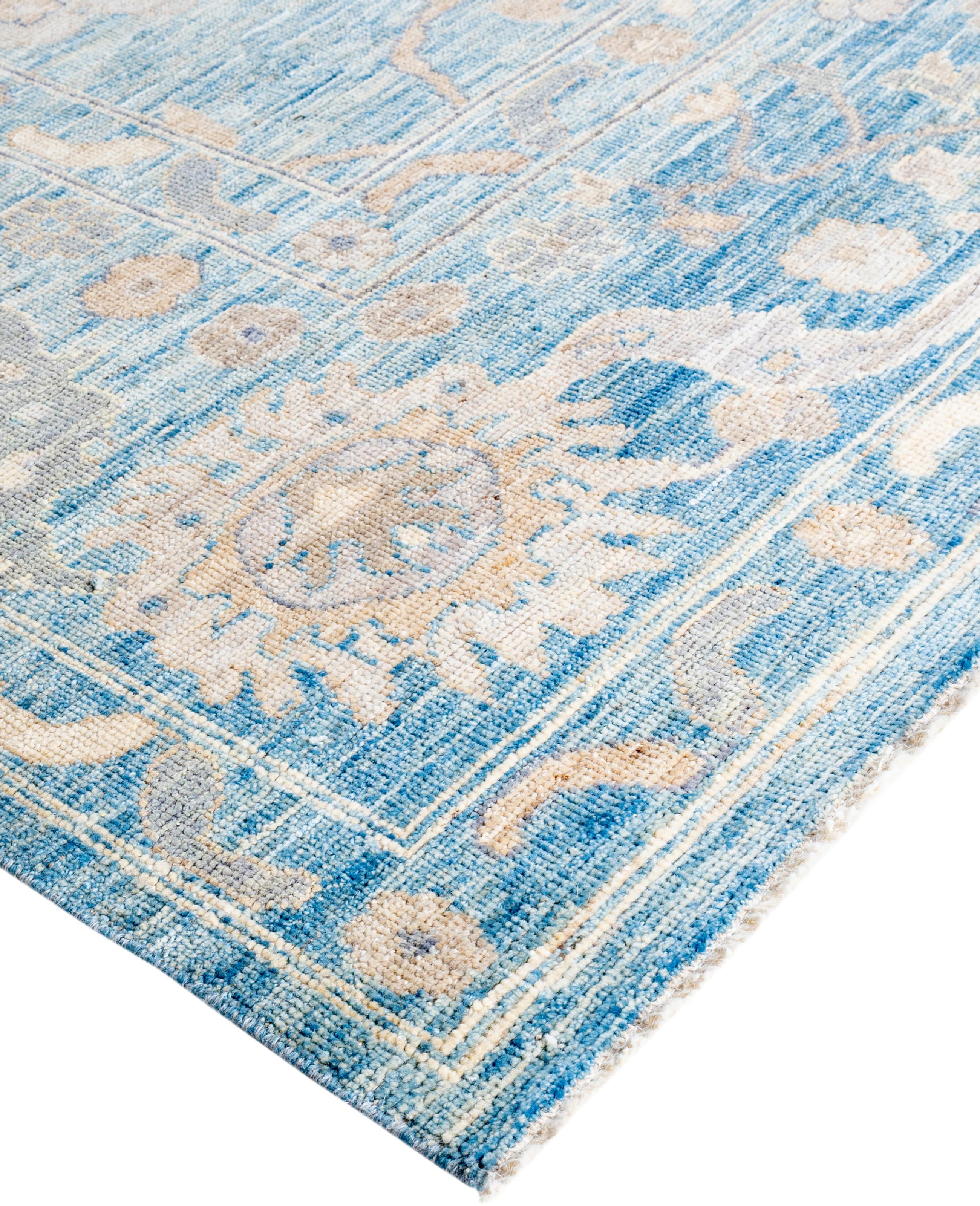 Oushak rugs are known for their soft, muted color palettes and large-scale, flowing designs. They often feature soft tones like beige, cream, gold, and light blue, with motifs that include palmettes, vines, and geometric shapes. These rugs are
