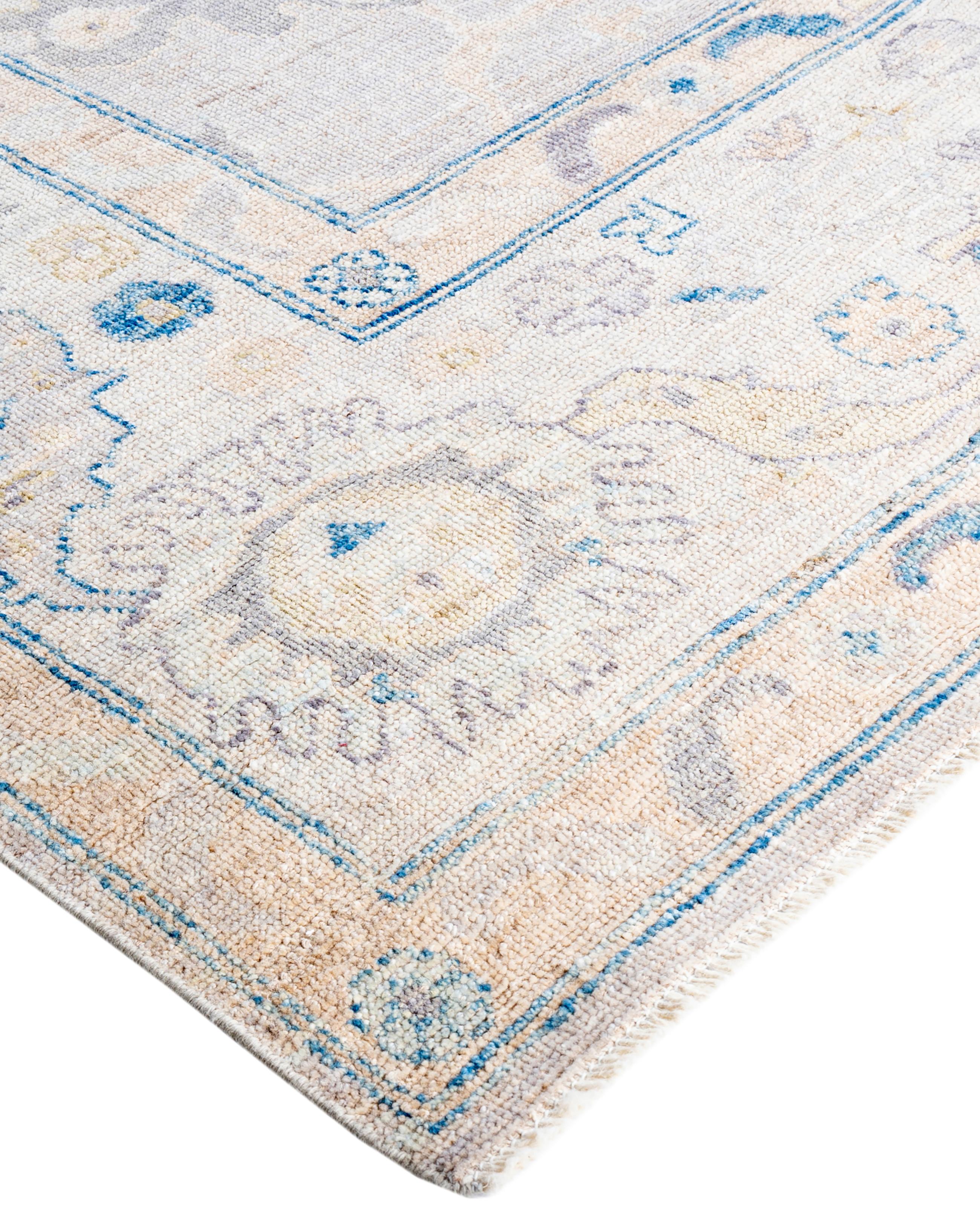 Oushak rugs are known for their soft, muted color palettes and large-scale, flowing designs. They often feature soft tones like beige, cream, gold, and light blue, with motifs that include palmettes, vines, and geometric shapes. These rugs are