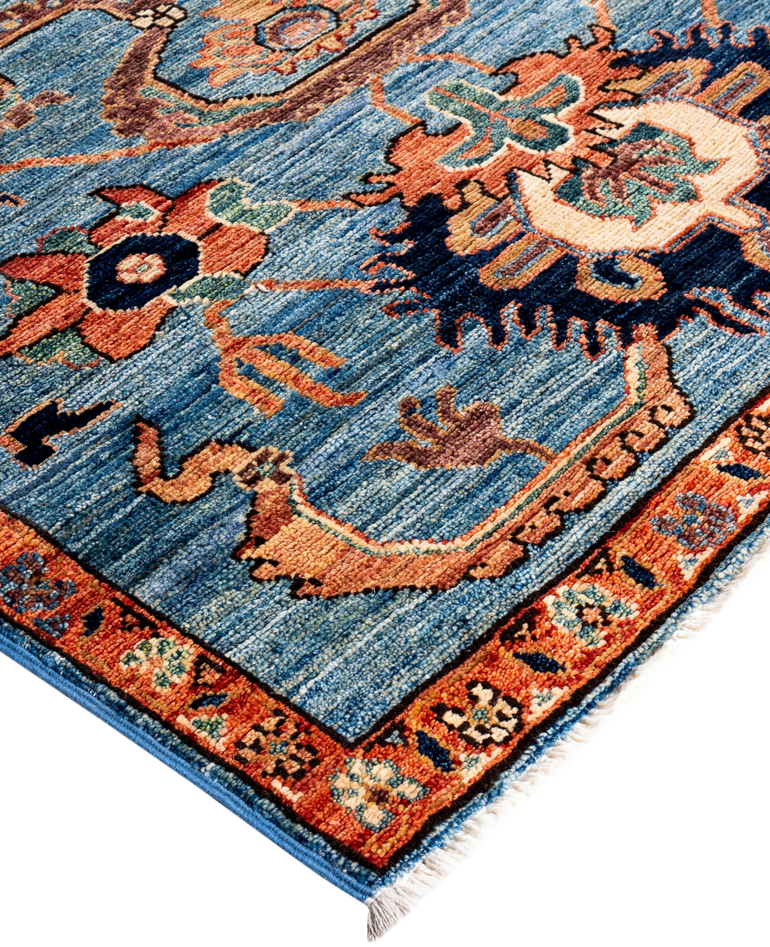 Serapi rugs are known for their bold, geometric designs and rich colors, often featuring a central medallion surrounded by intricate patterns. They typically use a warm, earthy color palette with deep reds, blues, ivory, and occasional greens. The
