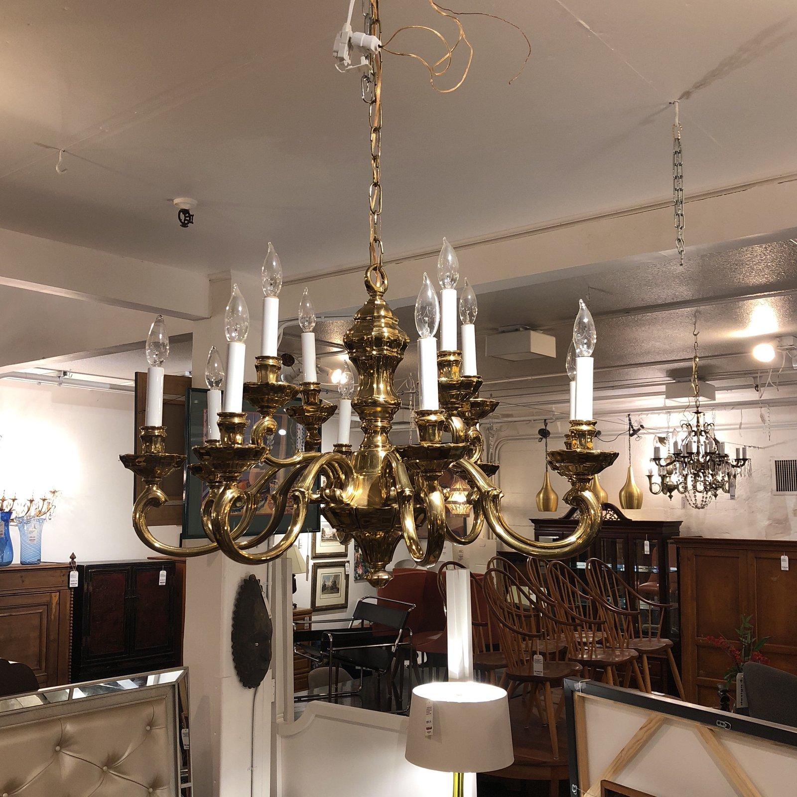 A solid brass chandelier. A Classic candle-style chandelier that consist of twelve lights and arms. Originally purchased from San Francisco Design Center. Original price $4,000.
 