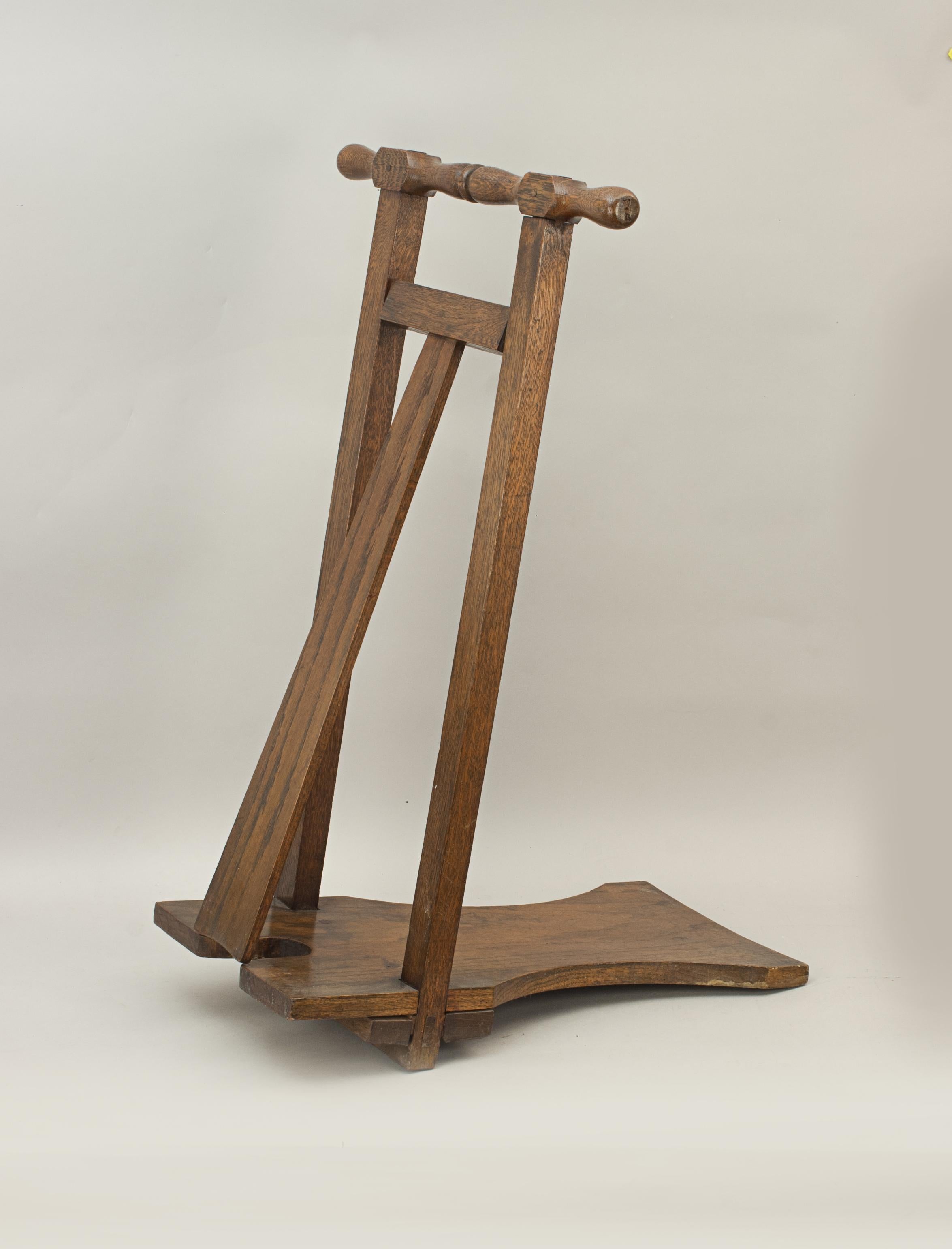 Antique oak boot jack.
A fine quality freestanding equestrian oak boot jack. Ideal for taking off Fox hunting or riding boots. The front frame being two square supports finished with a turned T-handle on top. The foot plate is shaped to take the
