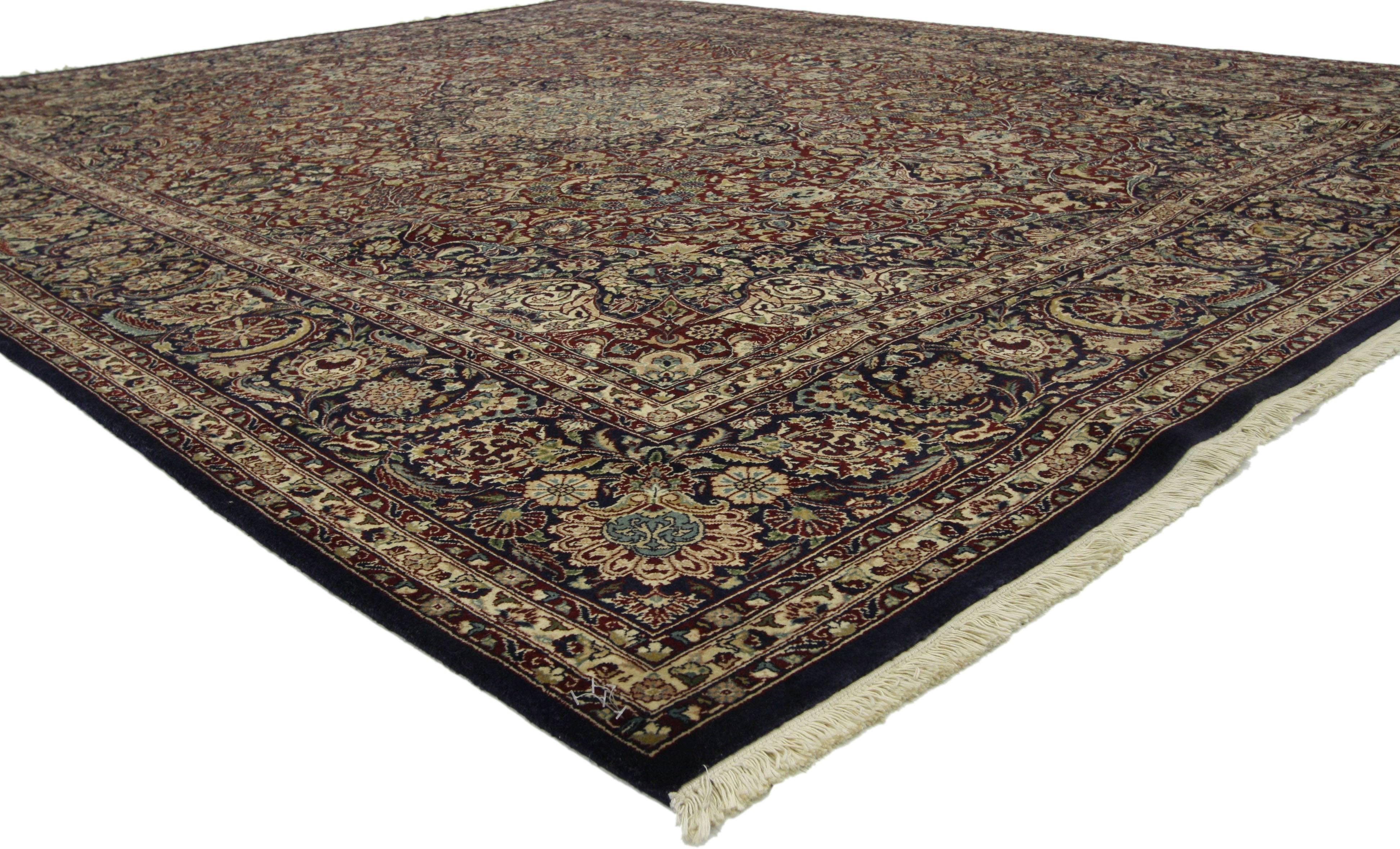 73491, vintage Pakistani Persian style rug with all over floral motif. This traditional Persian style rug features an intricate floral medallion floating in a frenzied garden of feathered wreaths, lush palmettes, stylized floral roundels and