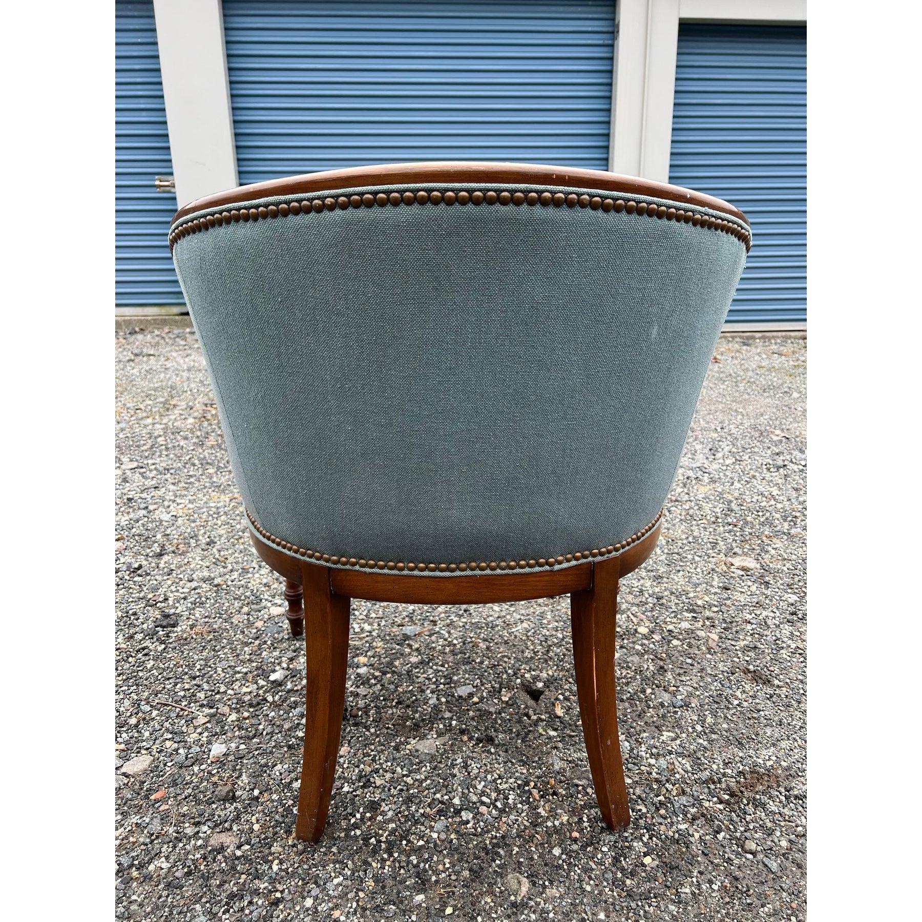 Traditional Vintage Side or Accent Chair!

This traditional vintage side or accent chair, featuring wood construction and brass rivet detailing, is upholstered in a rich blue fabric, offering a touch of classic charm. Its comfortable design and