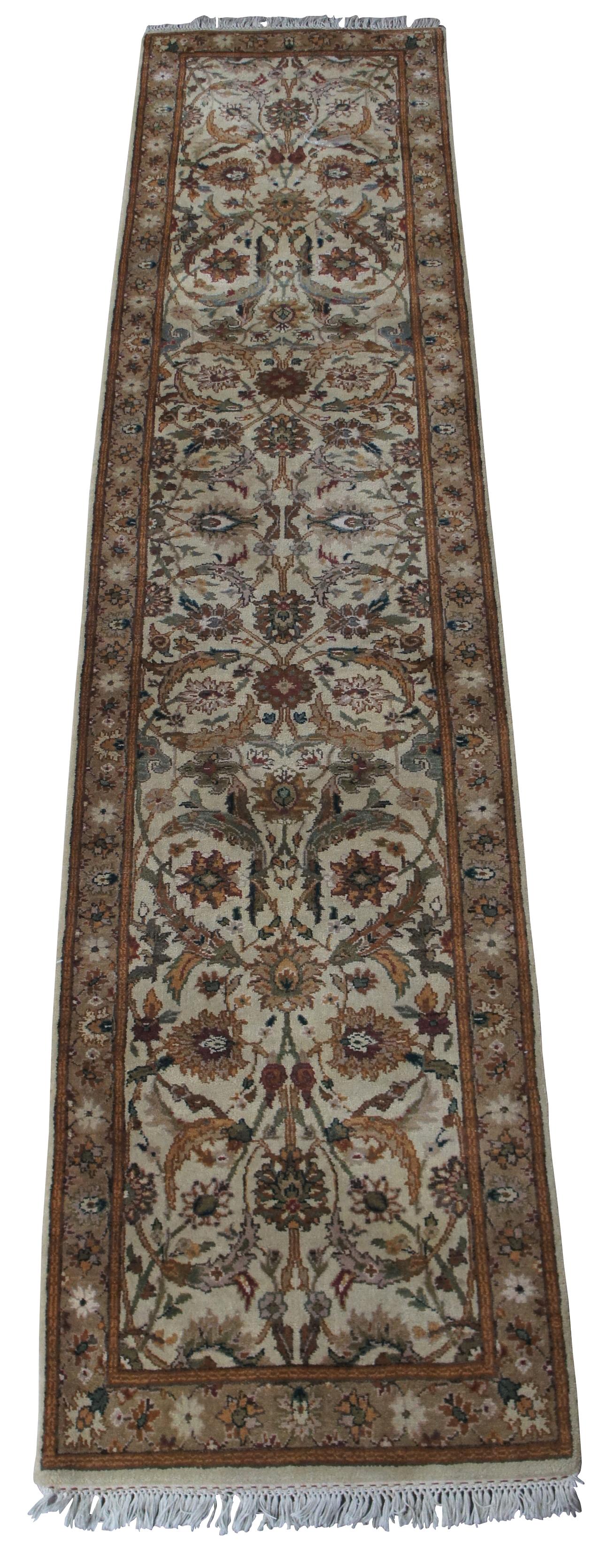 Vintage machine made rug runner featuring floral all over designs with grey, green, brown, blues, tan/beige and green. Measures: 3 x 12.
  