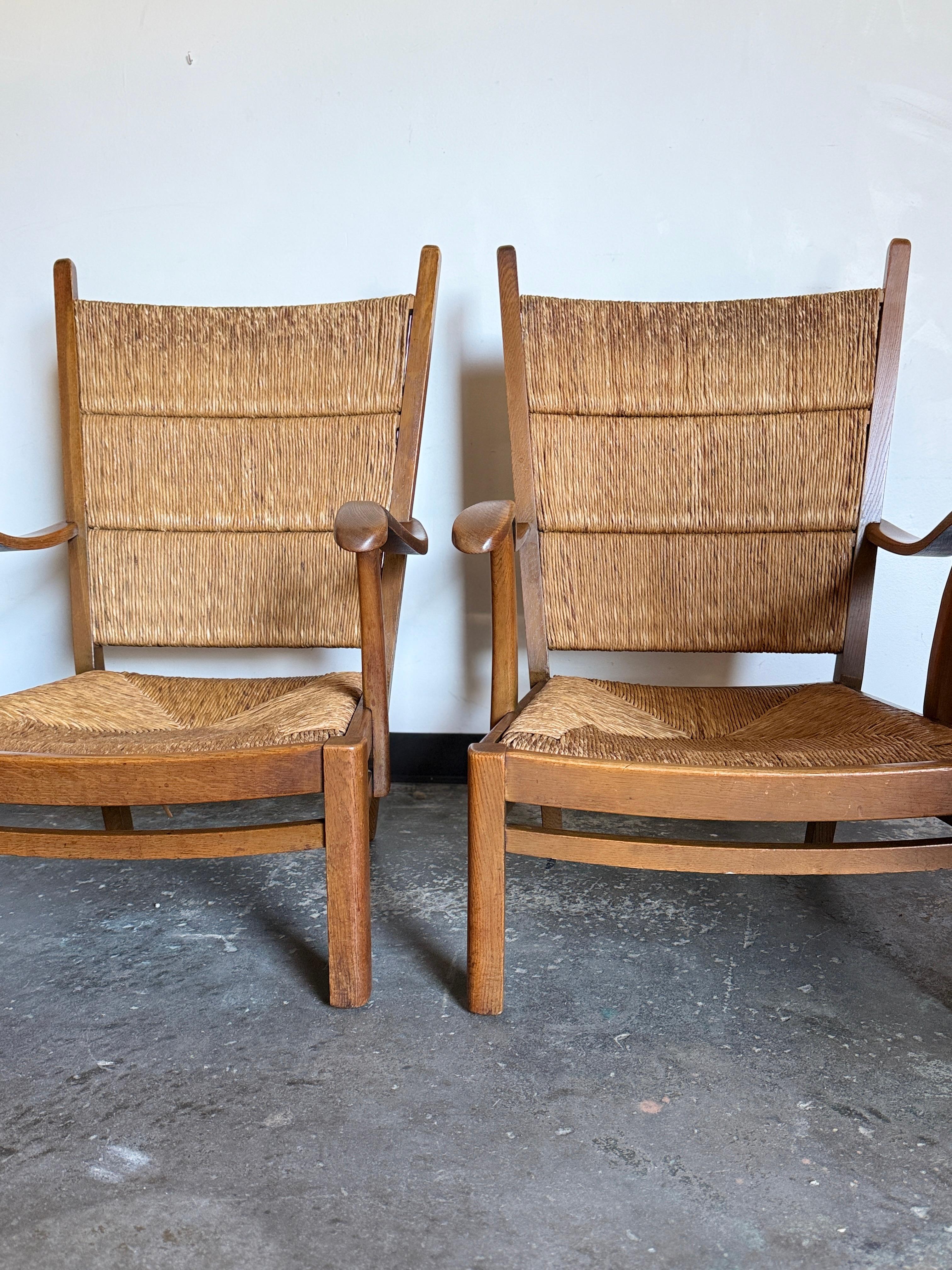 traditional armchair comprised of wood, rush, two available. In excellent vintage condition with age-consistent wear and patina. One chair does have slightly more patina. Lightweight, yet sturdy.