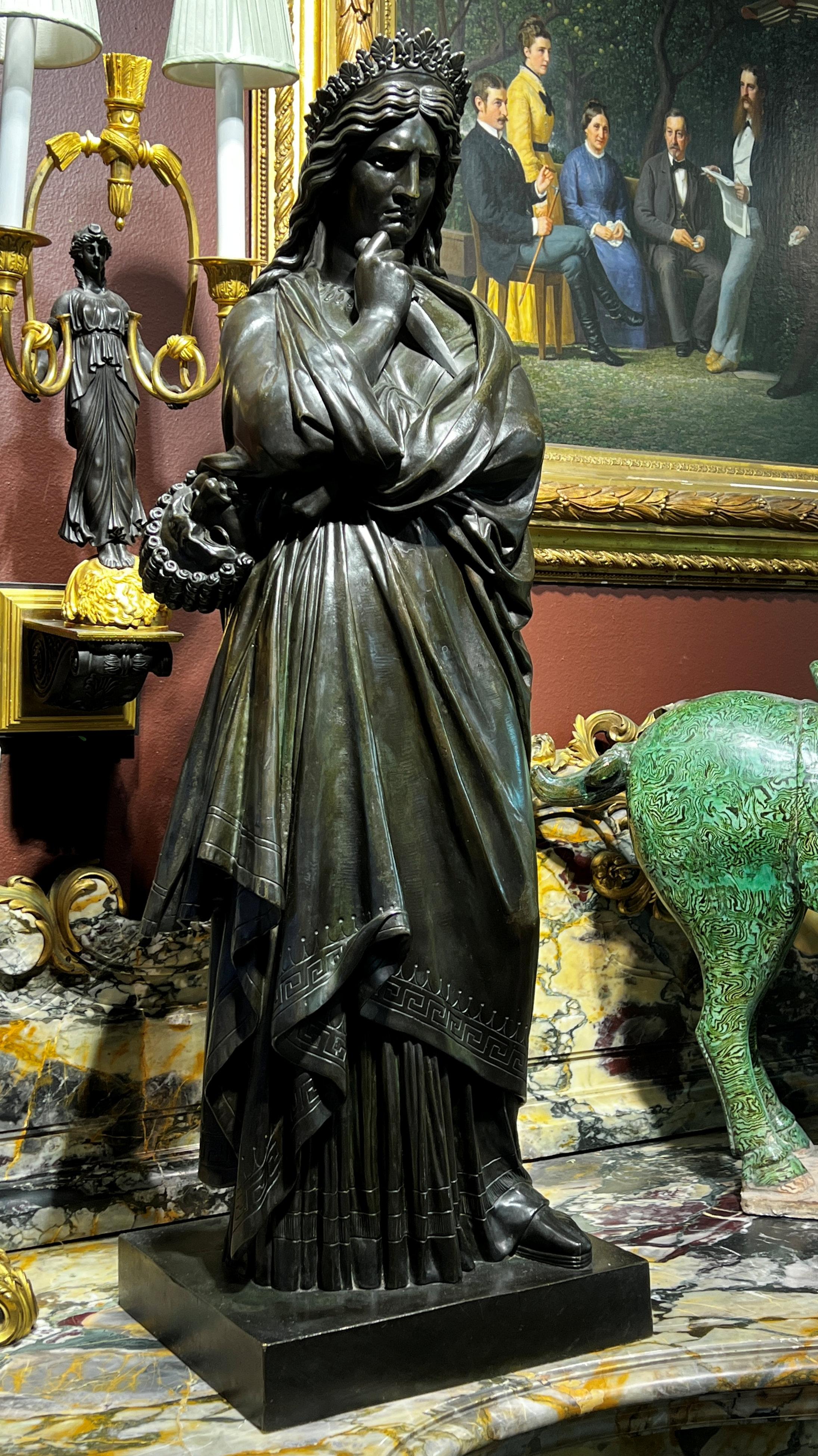Our patinated bronze, La Tragédie, after the French sculptor, Francisque Duret (1804-1865) measures 37.5 in (95 cm) and is in good condition, with a warm green-tinted brown patina.

Originally sculpted in marble, La Tragédie and La Comédie were