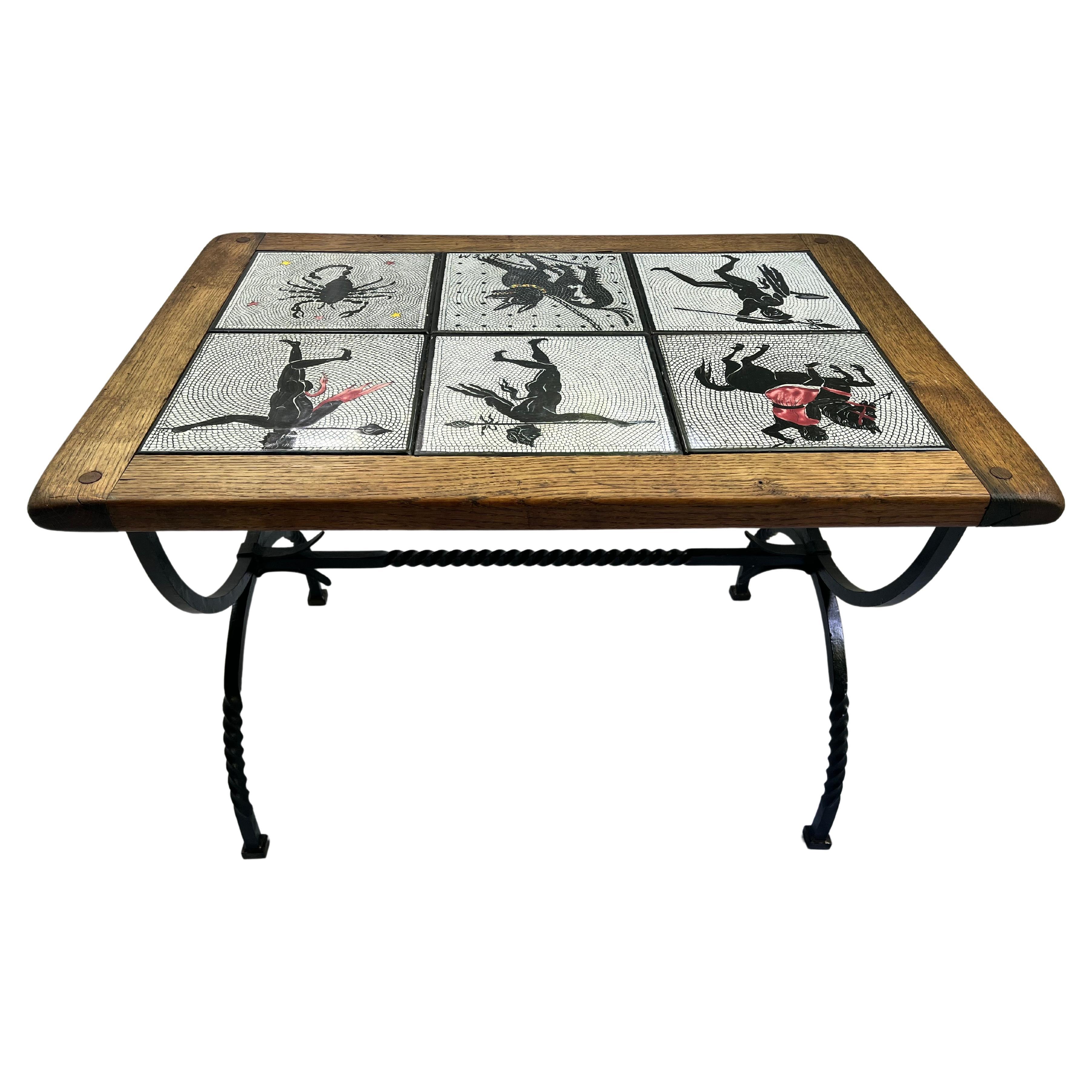 A vintage Italian tile top table with solid pegged wood frame and wrought iron base. The six oversized tiles on the top are vintage renditions of the style of tile found in the Tragic Poet House of Pompeii. Cave Canem. This well known tile is one of