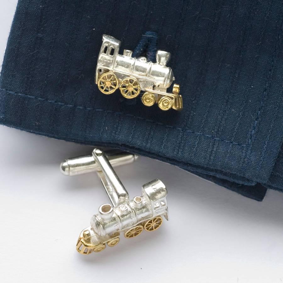 Striking train cufflinks, Solid Sterling Silver with 18 Karat Gold highlights.
One of Simon's latest designs, this superbly detailed steam locomotive sits proud and beautifully on the cuff. The wheels are picked out with a layer of 18 carat gold and