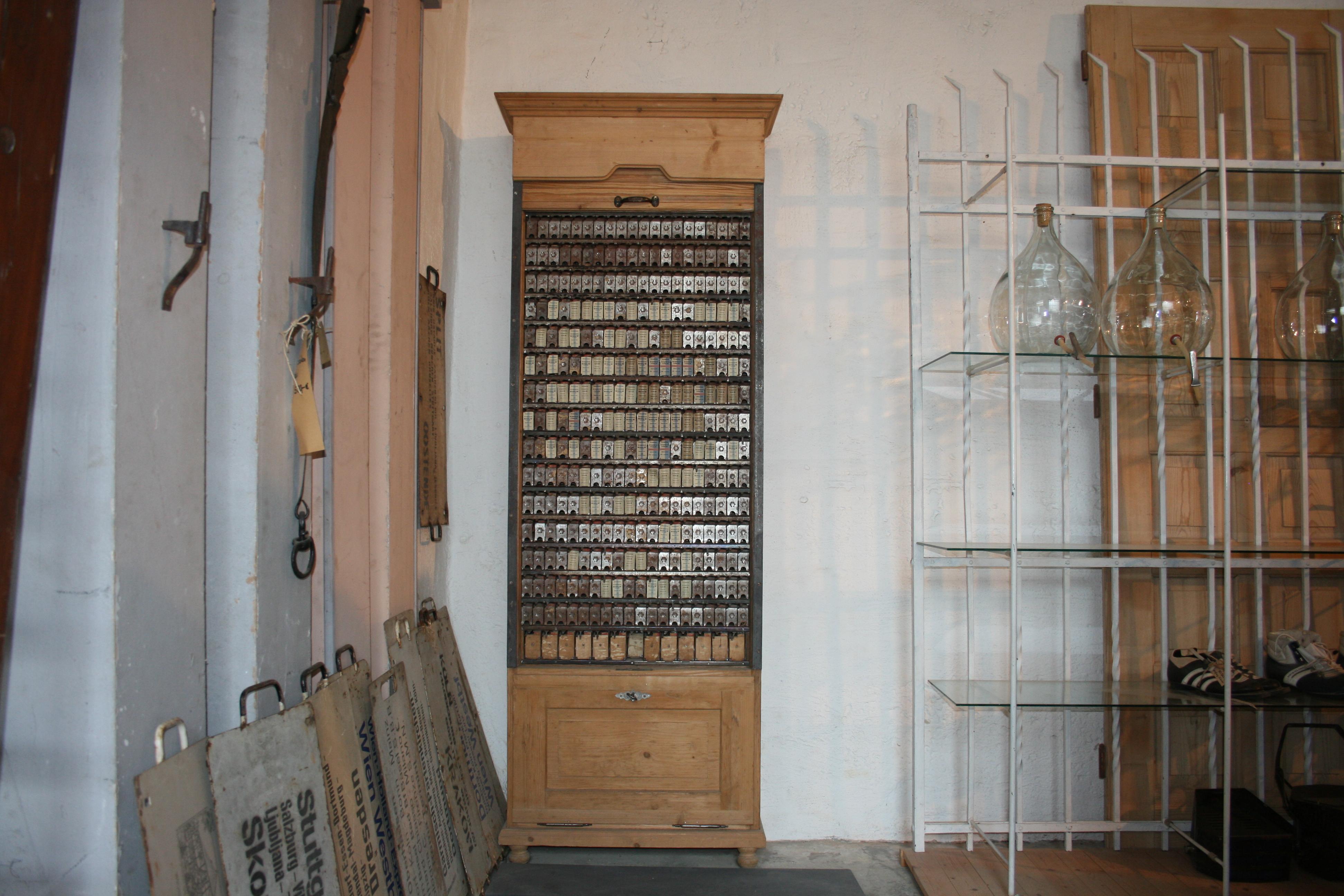 Extremely rare original old train station ticket cabinet from Germany, made of softwood and metall. Behind the absolutely functional roller shutters are the metal compartments for the various train tickets (see photos). Underneath is a flap to open