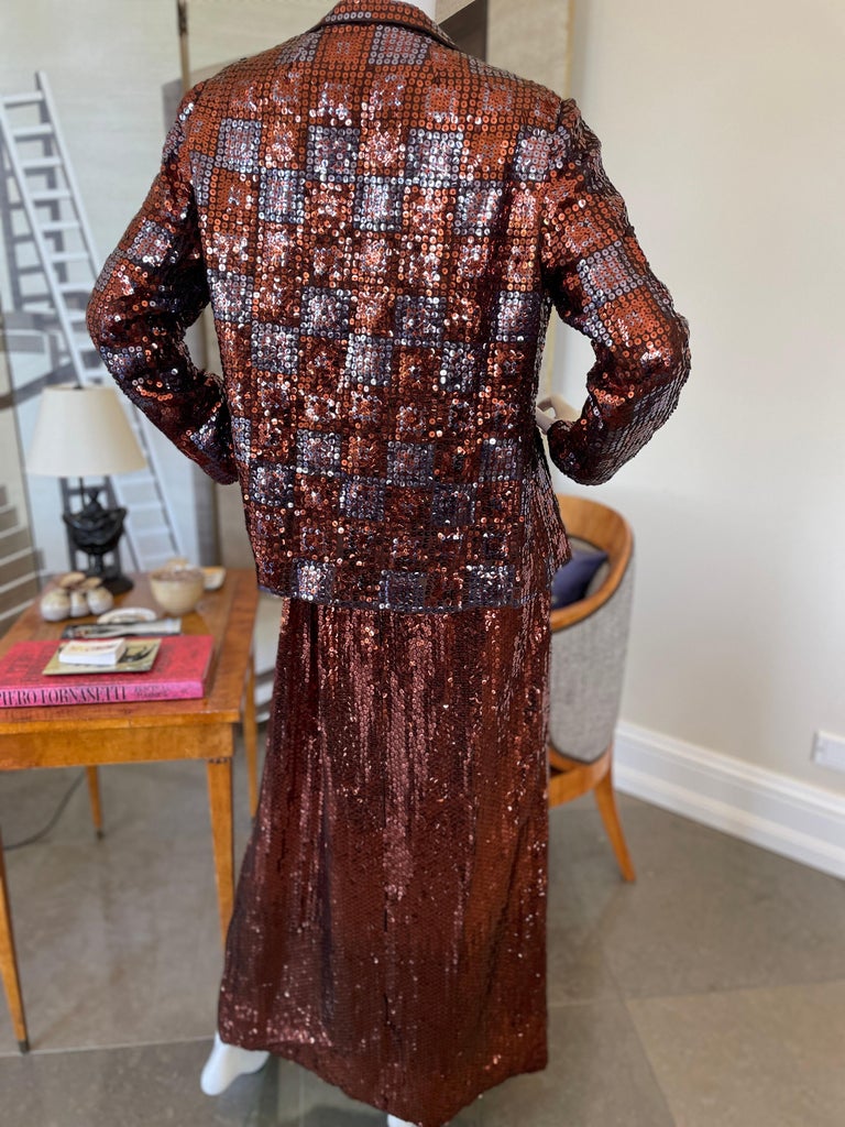 Traina 1960 Copper Sequin Evening Dress with Matching Jacket.
Anthony Traina was the financial backer , and manufacturer of Norman Norell , one of America’s most significant designer of this era. The collection was sold under the Traina Norell