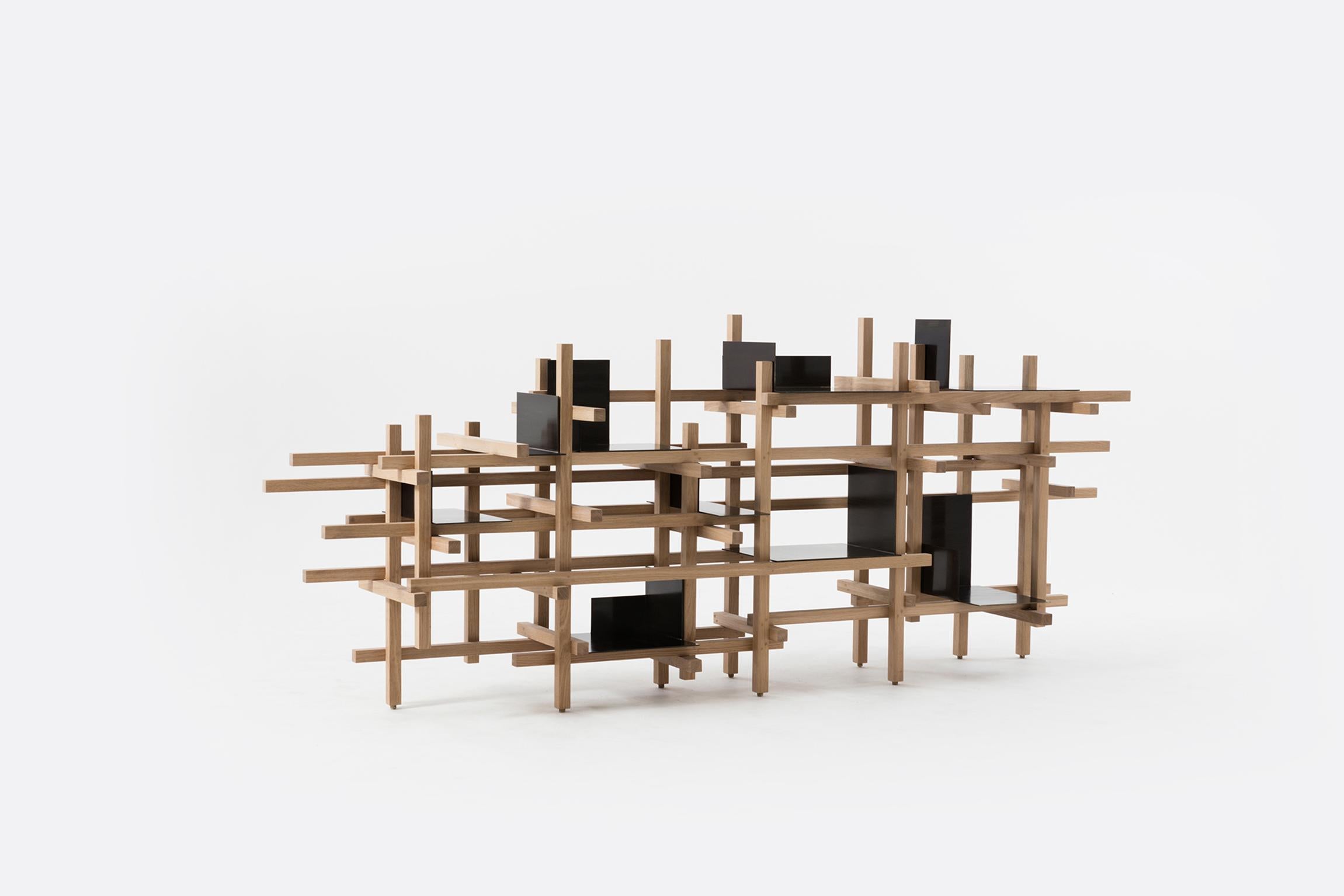 A limited edition made from wood and brass, inspired by the temporary structures
used in construction.
Designed asymmetrically, the latticework intersects with and is crisscrossed by wooden bolts. The primary wood structure supports a series of