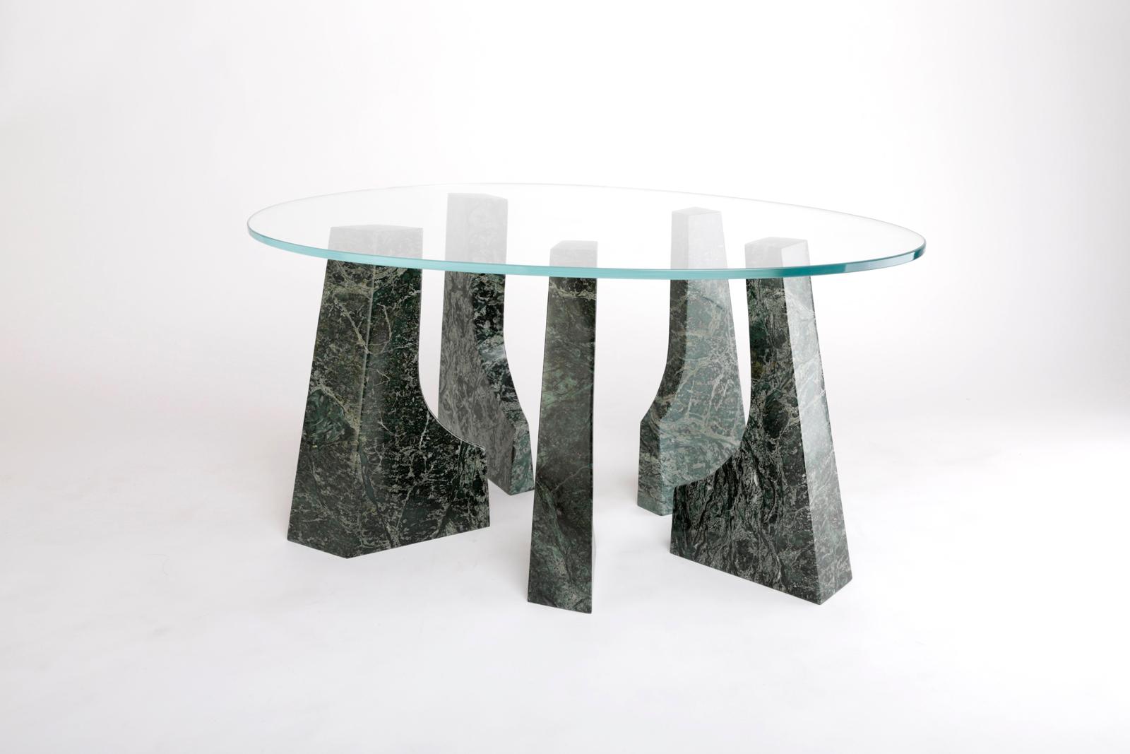 Trama coffee table by Comité de Proyectos
Dimensions: 80 x 52 x H 38 cm
Materials: Green Tikal marble, 9mm tempered glass

The Trama Baja table is inspired by CU's sculptural space, adding a glass top to the loose pieces that allows to discover