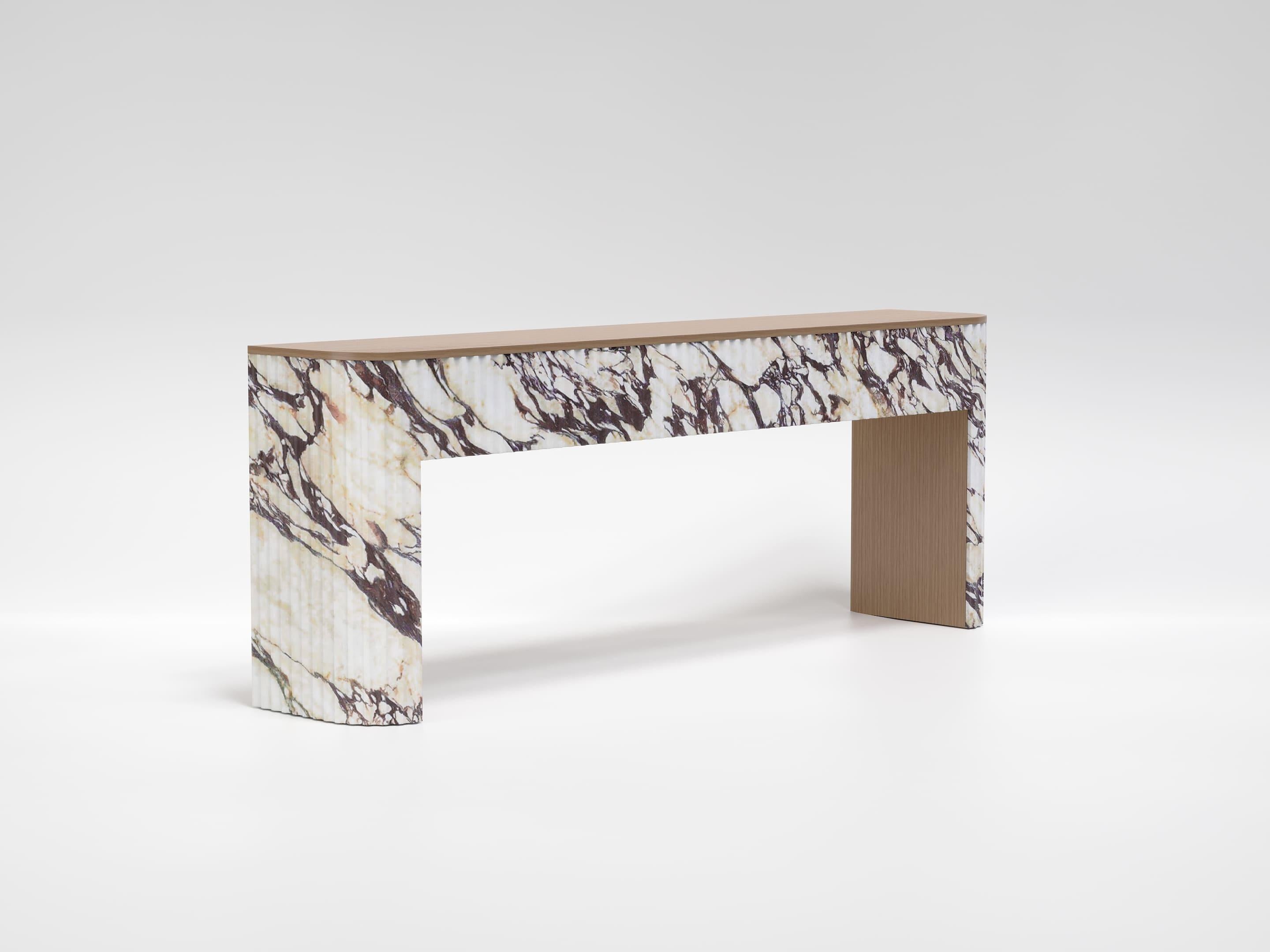 A piece of furniture that combines sculptural elegance and natural warmth. This console table is made entirely of top-quality Calacatta Viola marble and white oak, two noble materials that interact harmoniously.

The base, characterized by refined