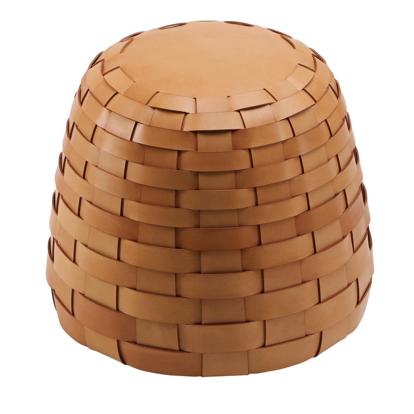 A medium round pouf designed by viola tonucci, featuring a natural tone and a distinctive woven pattern. its seat measures 38 cm in diameter and stands 46 cm high, offering both comfort and style. the pouf's robust construction and soft contours