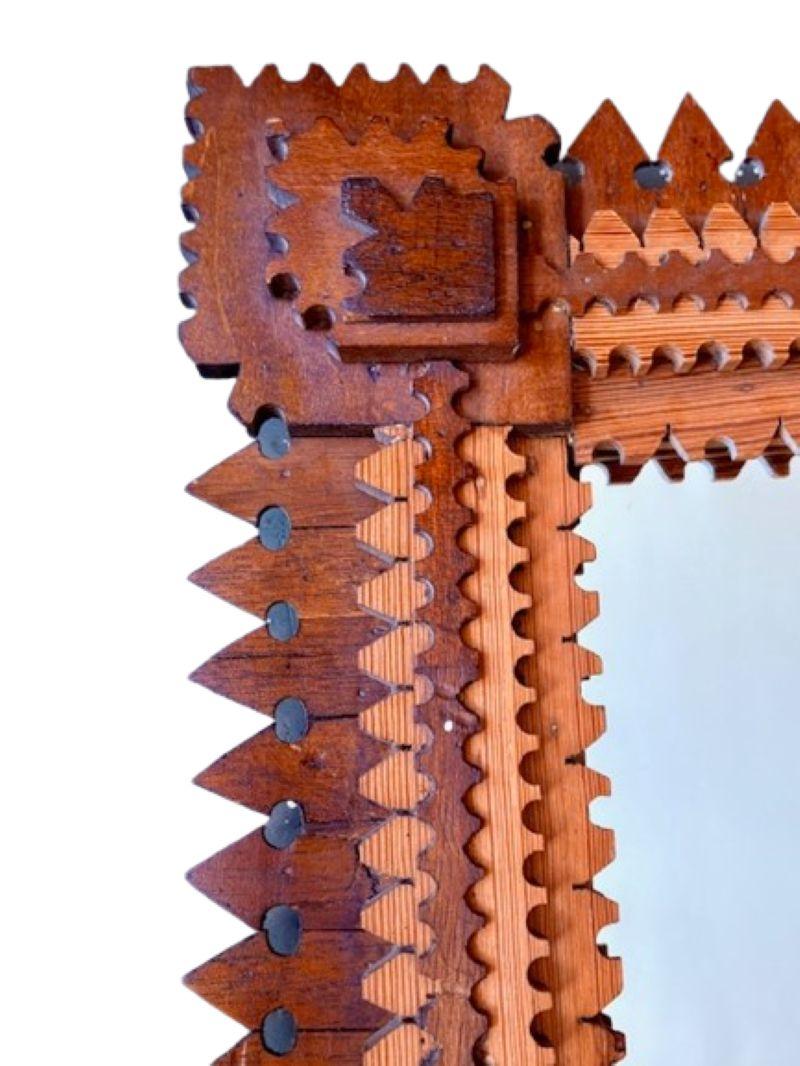 Antique Tramp Art Hand Crafted Mirror Frame, circa 1900 - 1920, with hand cut diamond corners and hastate borders. This is an early frame that predates the multi-layered 